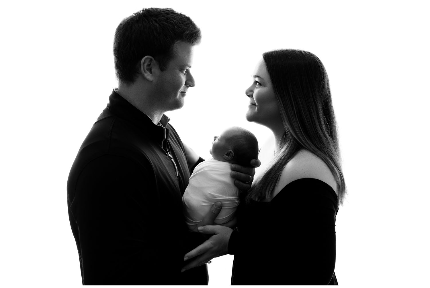 A series of silhouetted couples in intimate poses against a light background.
