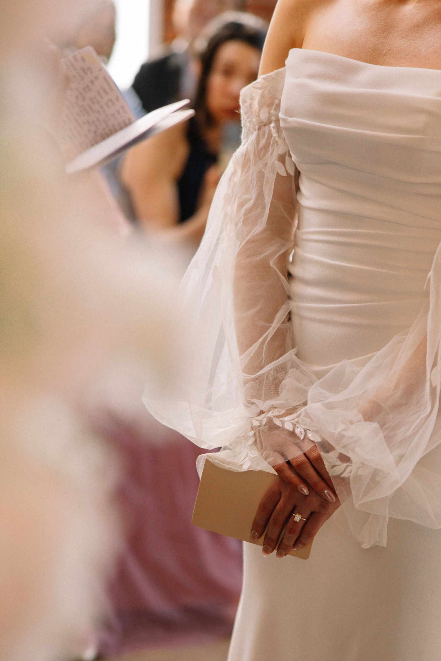 bride holding vow book