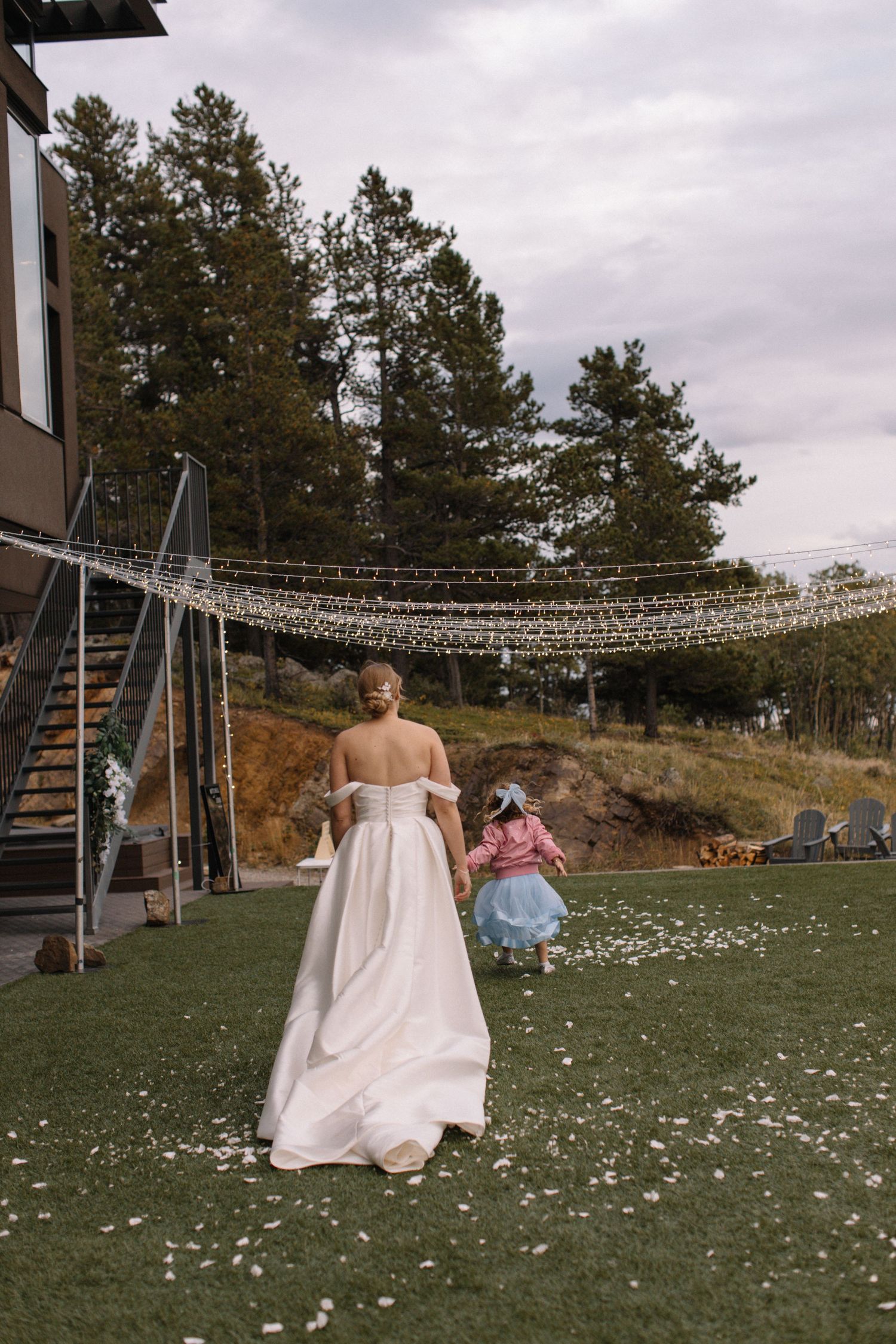 bride playing with flower gril