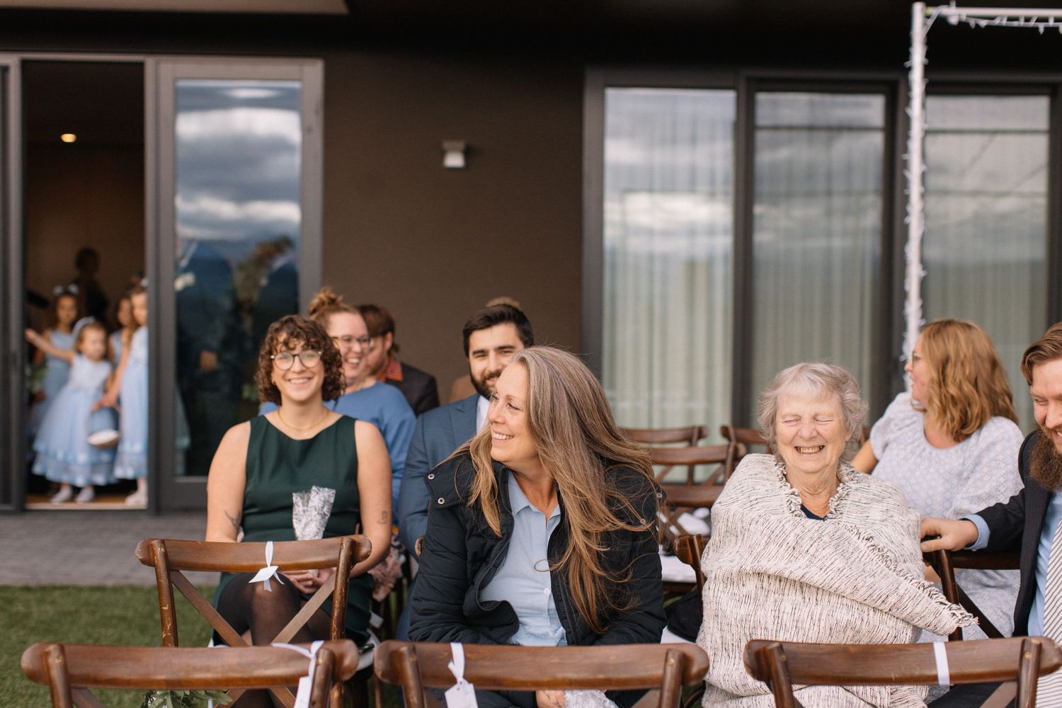 friends and family laughing before the ceremony