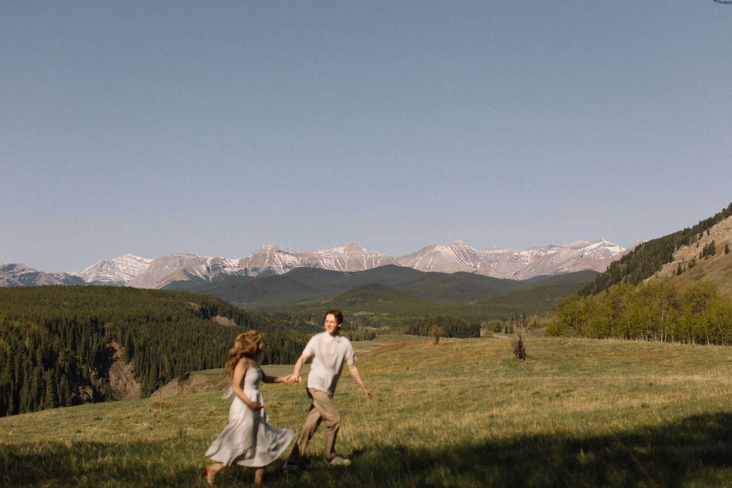 couple running in the rockies