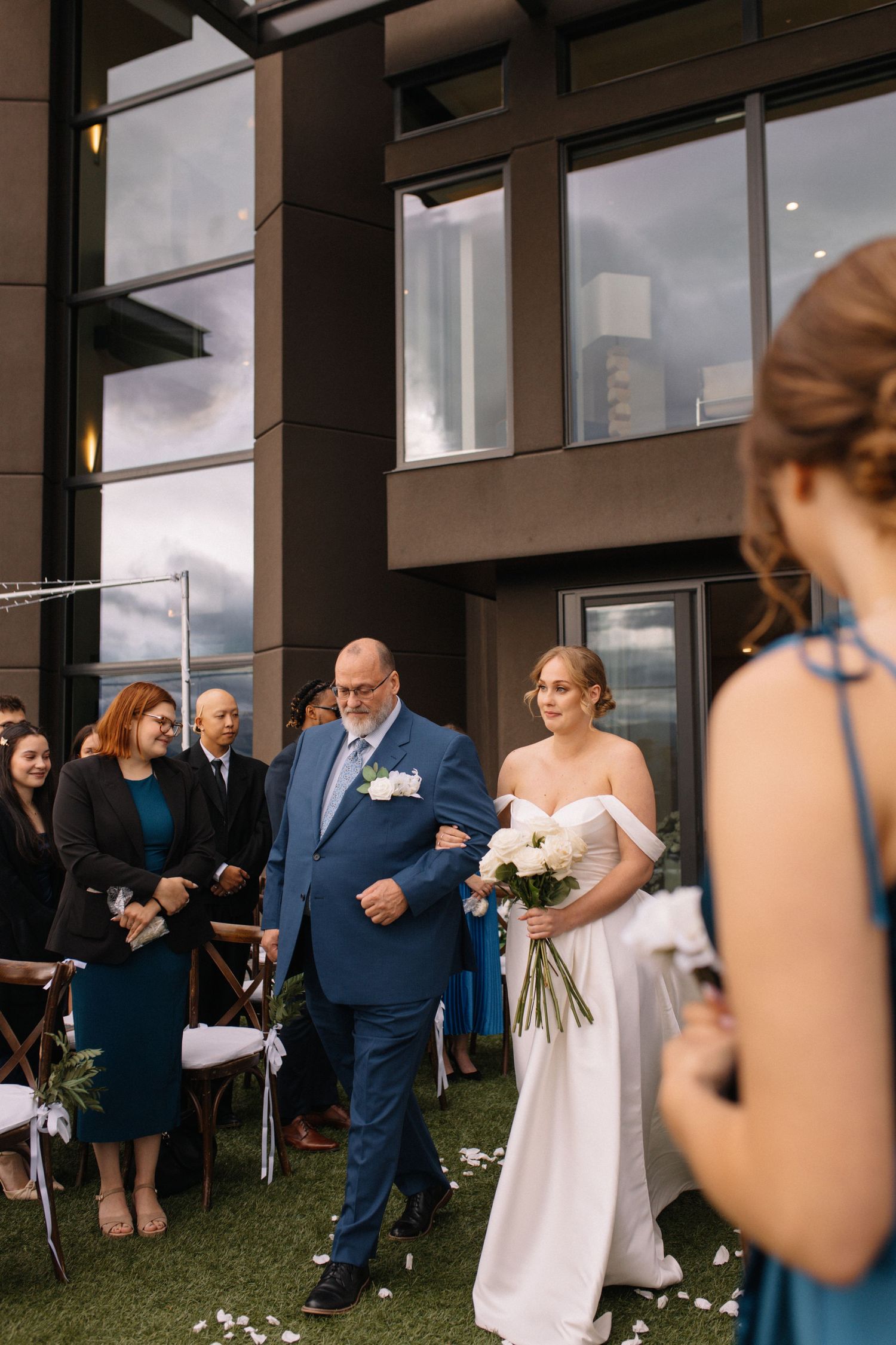 bride walking down the aisle with father