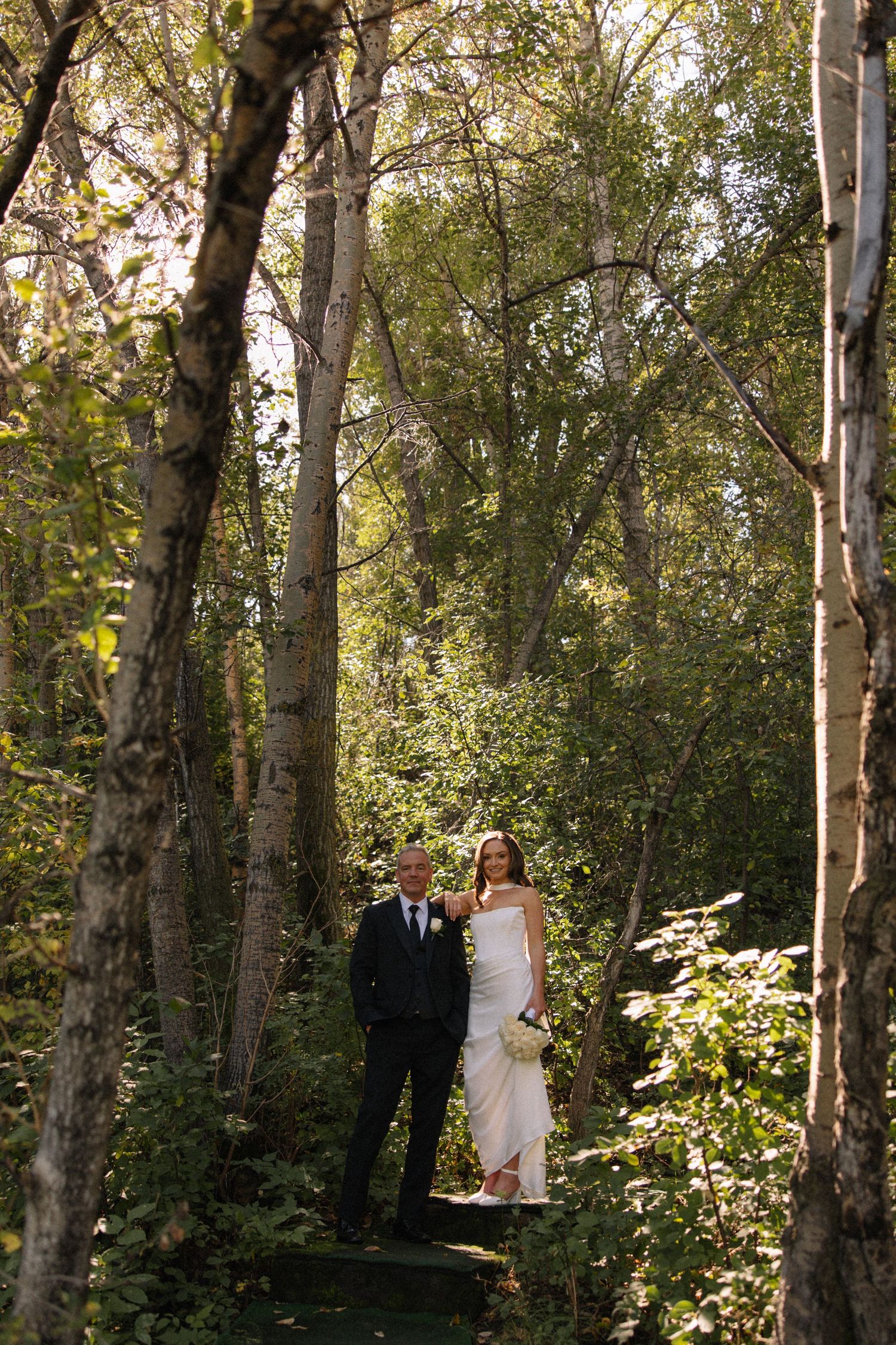 bride and groom portrait in trees