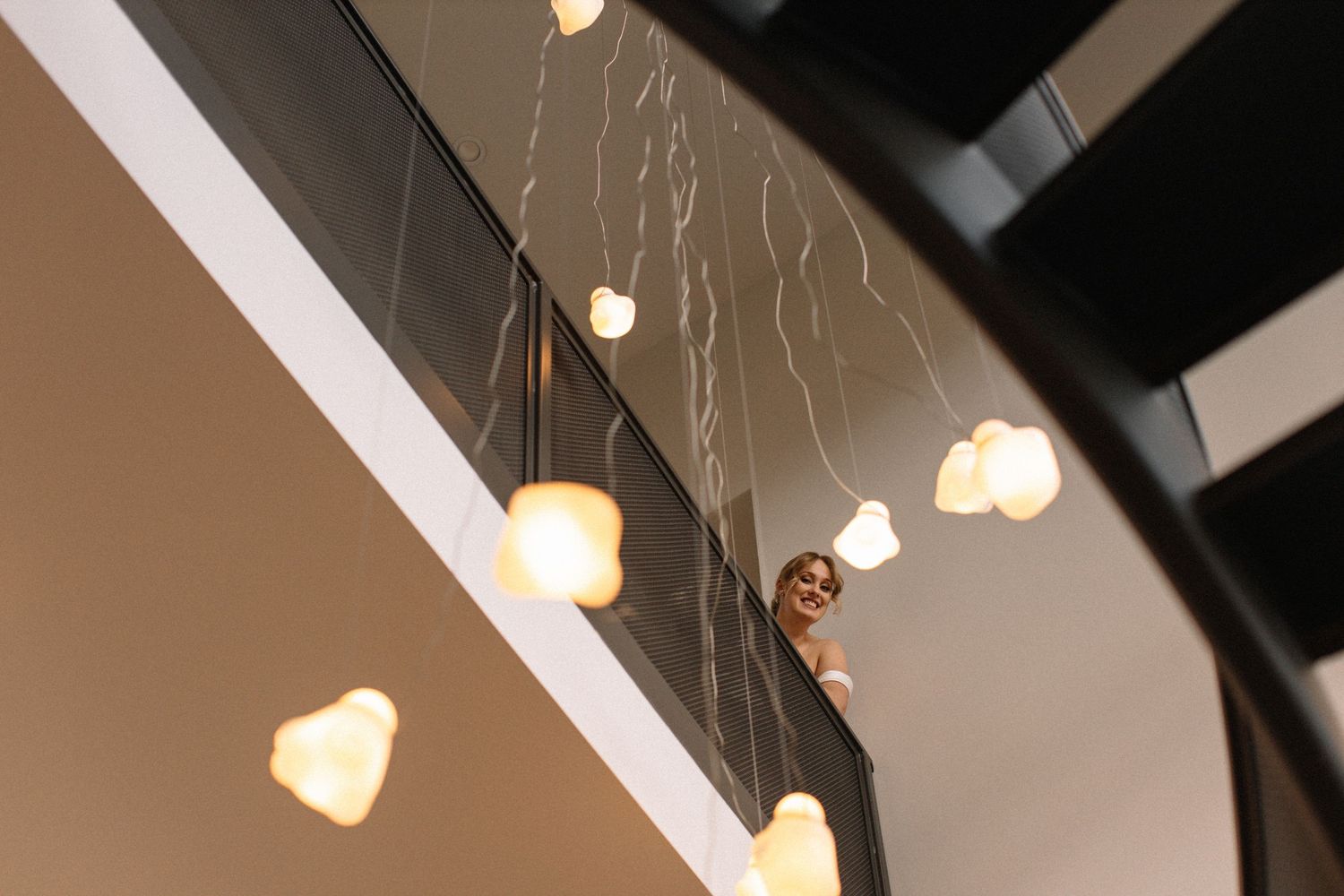 bride peeking over stairs