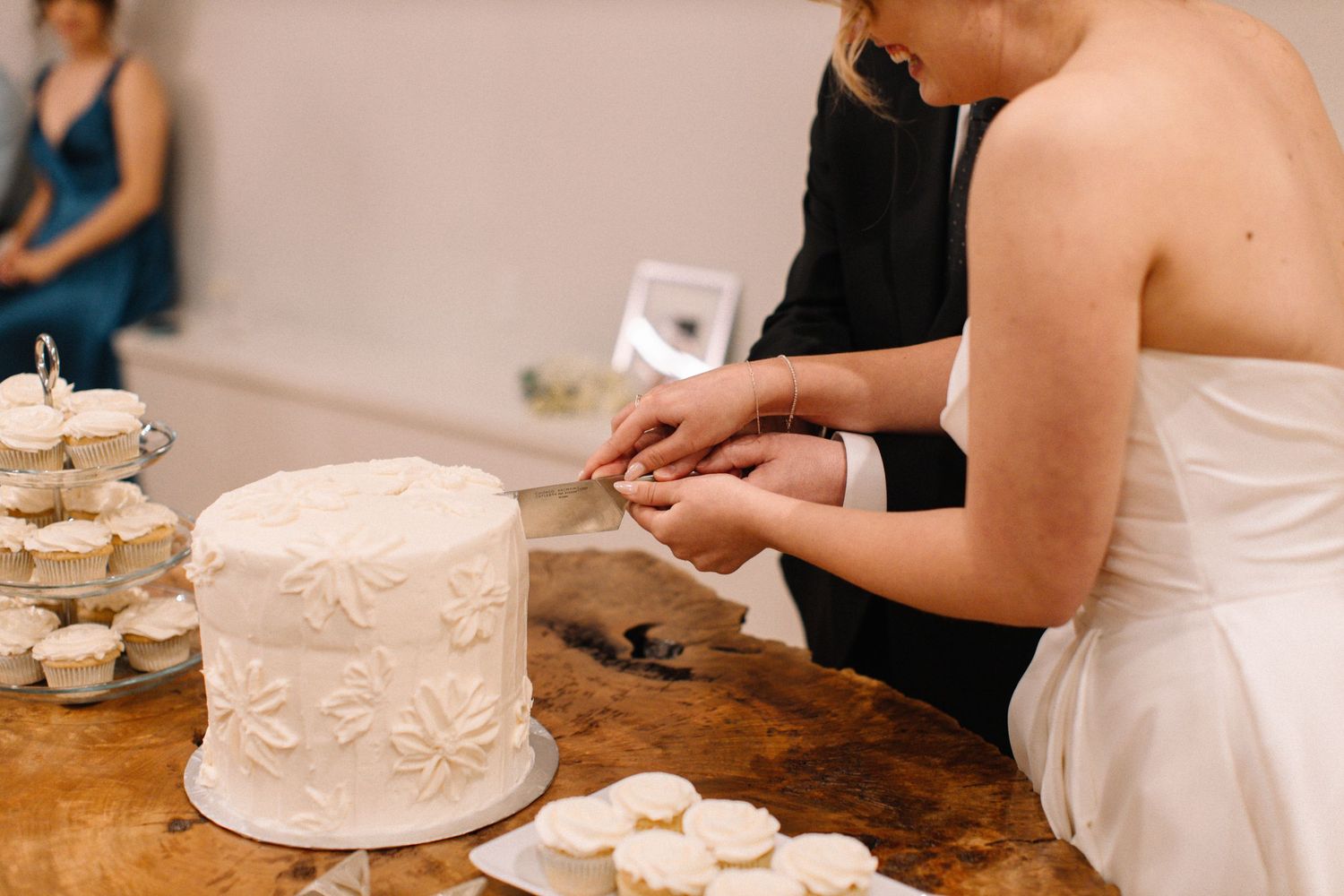 Bride and groom cutting cake