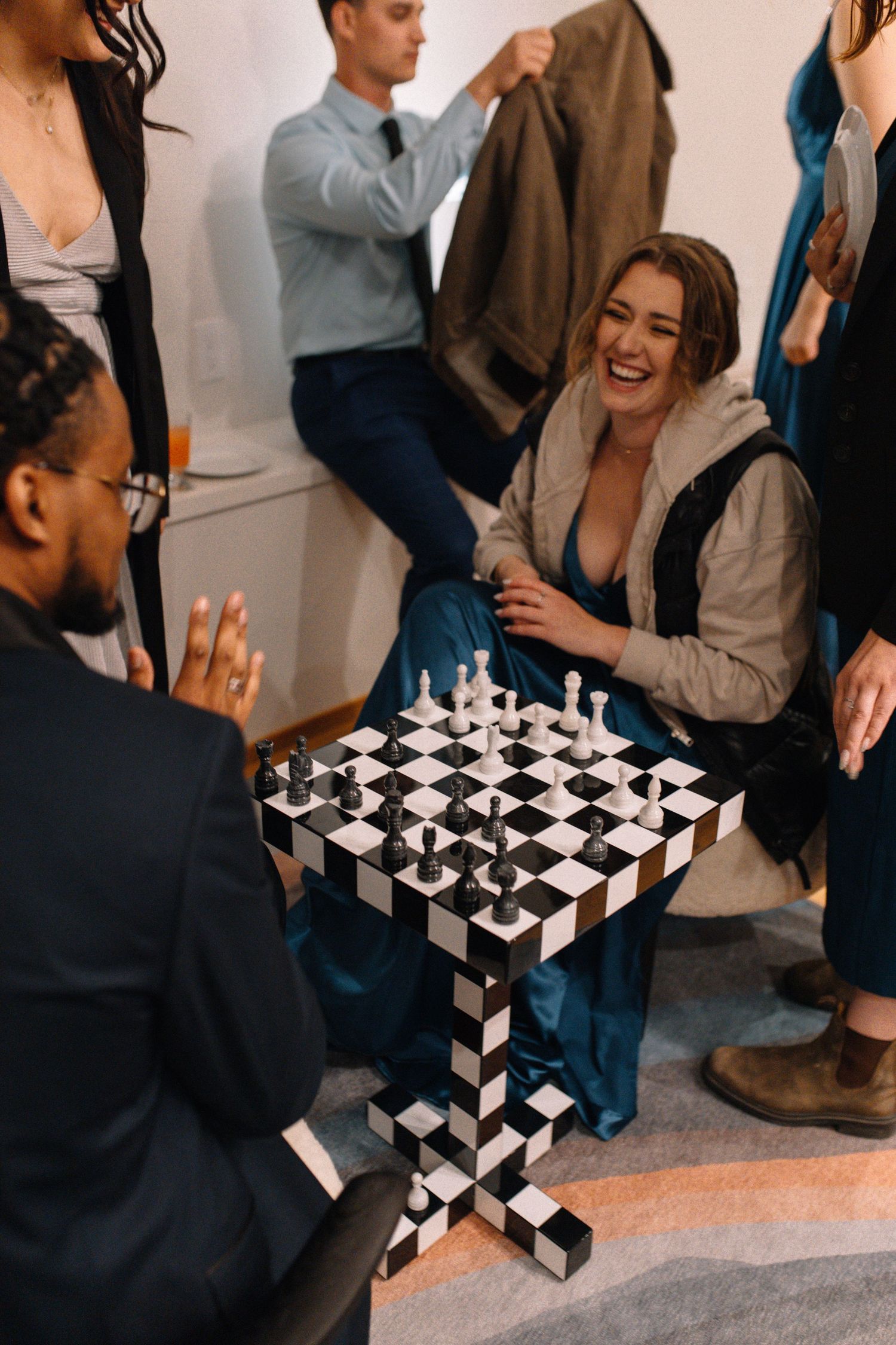 wedding guests playing chess and laughing