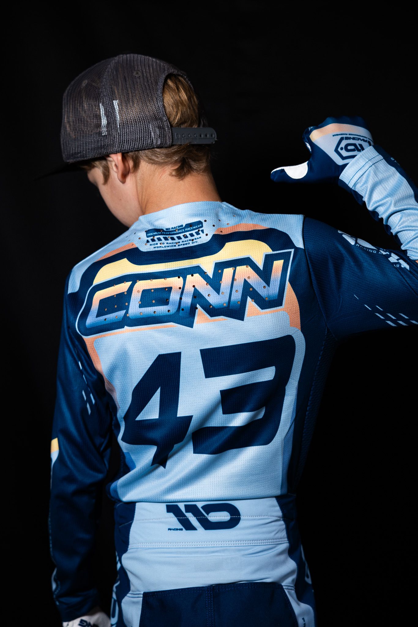 Close-up shots of navy and light blue sports jersey showing number 43 from different angles and perspectives.