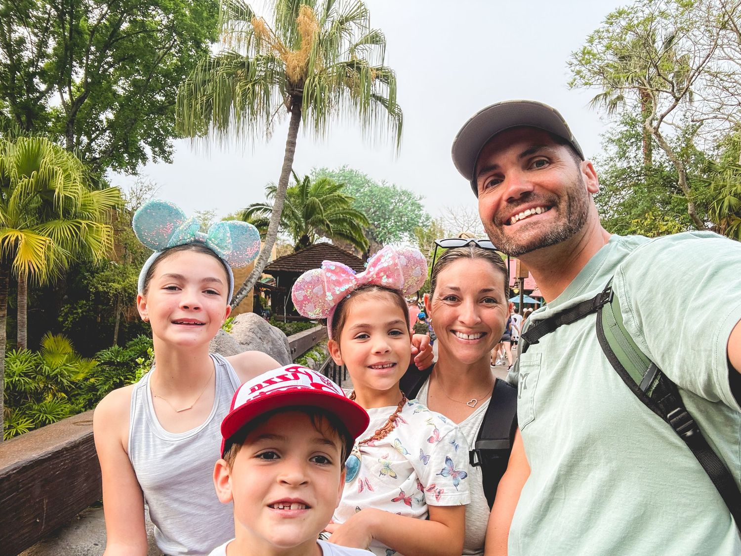 Collection of outdoor selfies taken during a sunny day with palm trees in background.