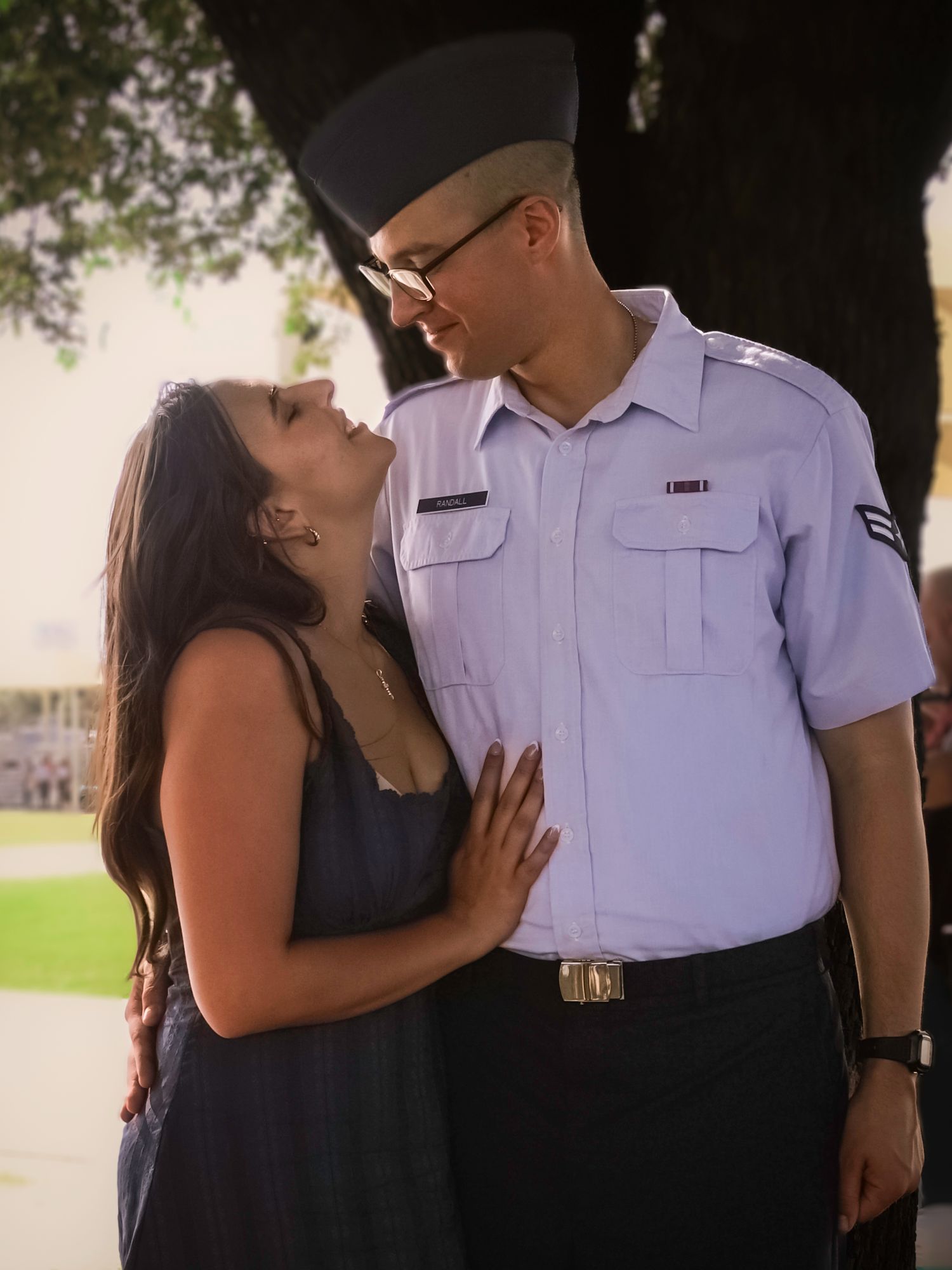 Airman sharing a special moment with his partner after graduation during a military family photography session in Colorado Springs, Colorado
