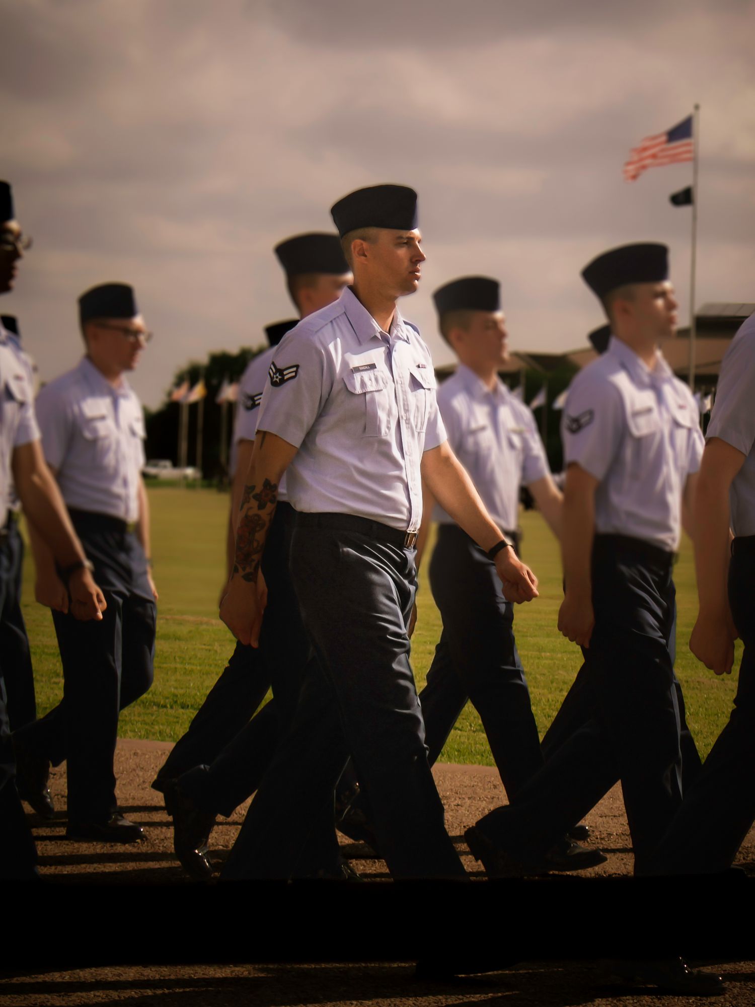 Airmen marching in formation during a U.S. Air Force graduation ceremony in Colorado Springs, Colorado.
