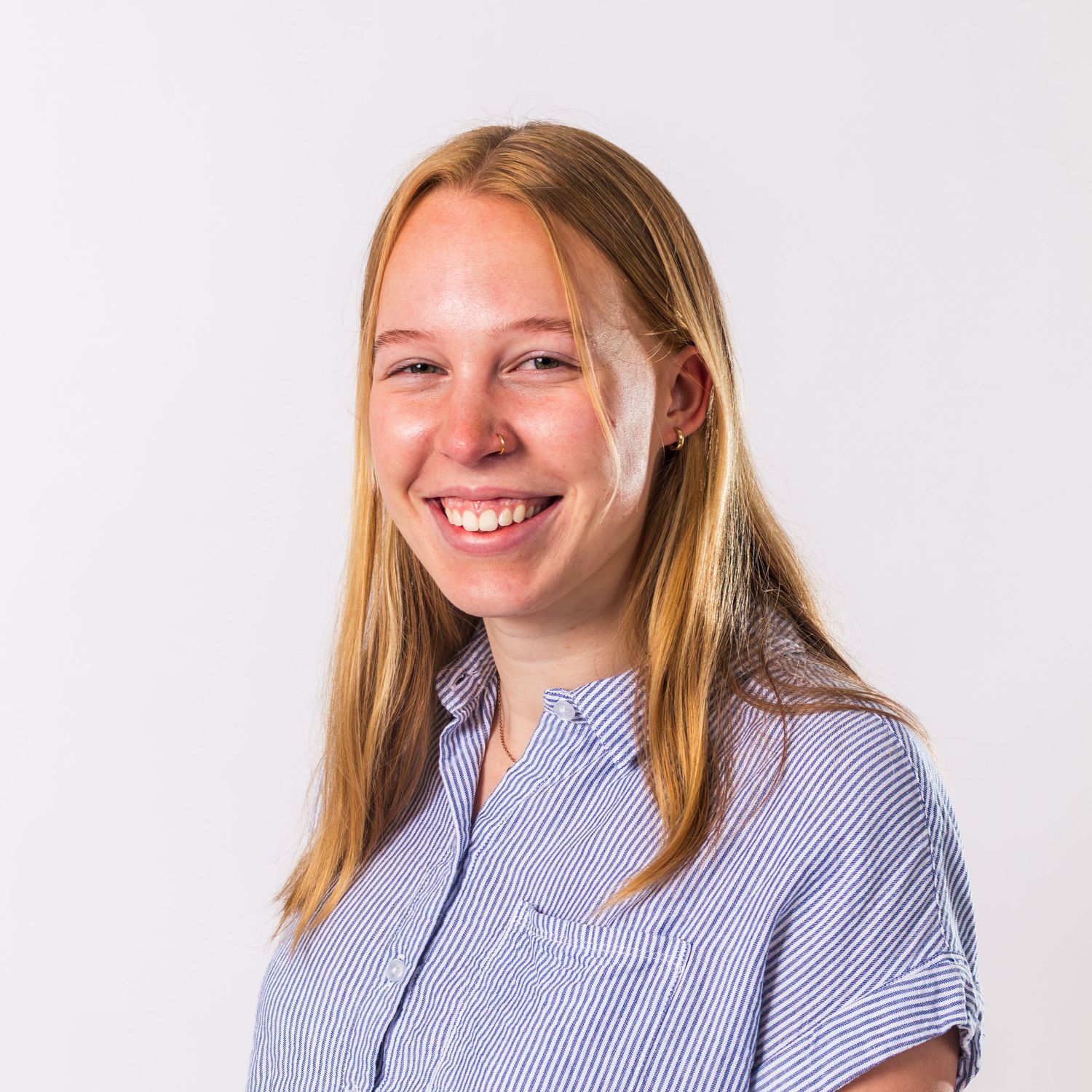 Professional headshot series showing person with blonde hair wearing blue striped shirt against white background.