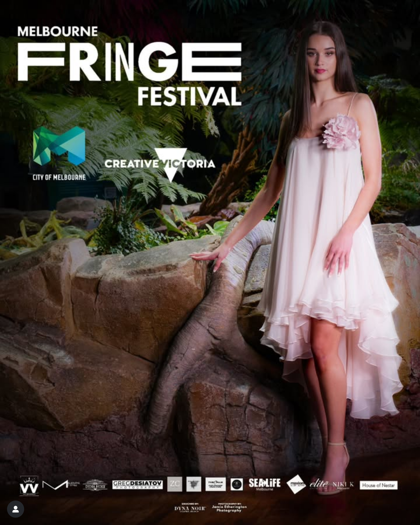 Promotional poster for Melbourne Fringe Festival featuring a person in a flowing pink dress standing on rocky terrain.
