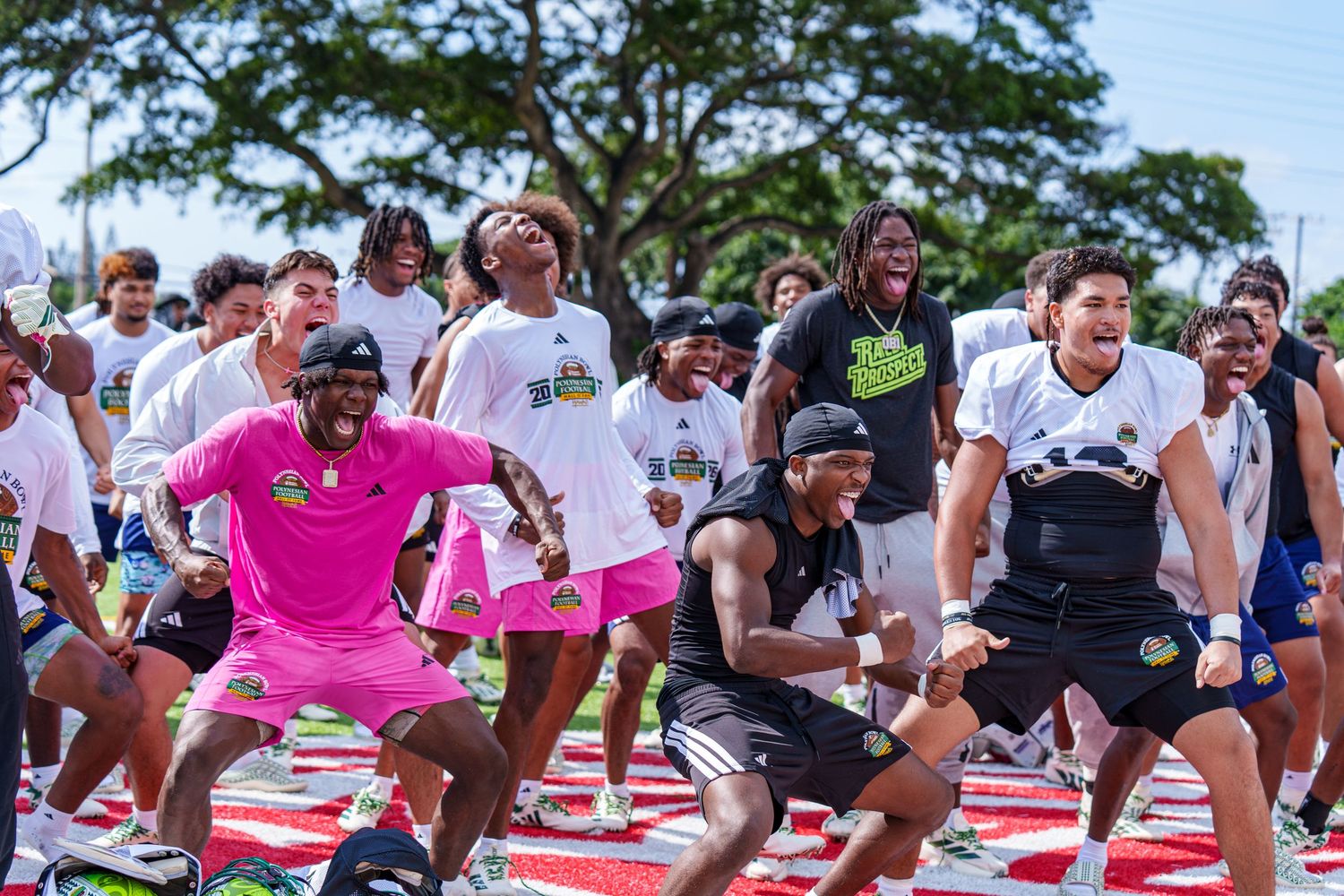 People compete in a fun outdoor game of Twister on multiple mats during a sunny day event.
