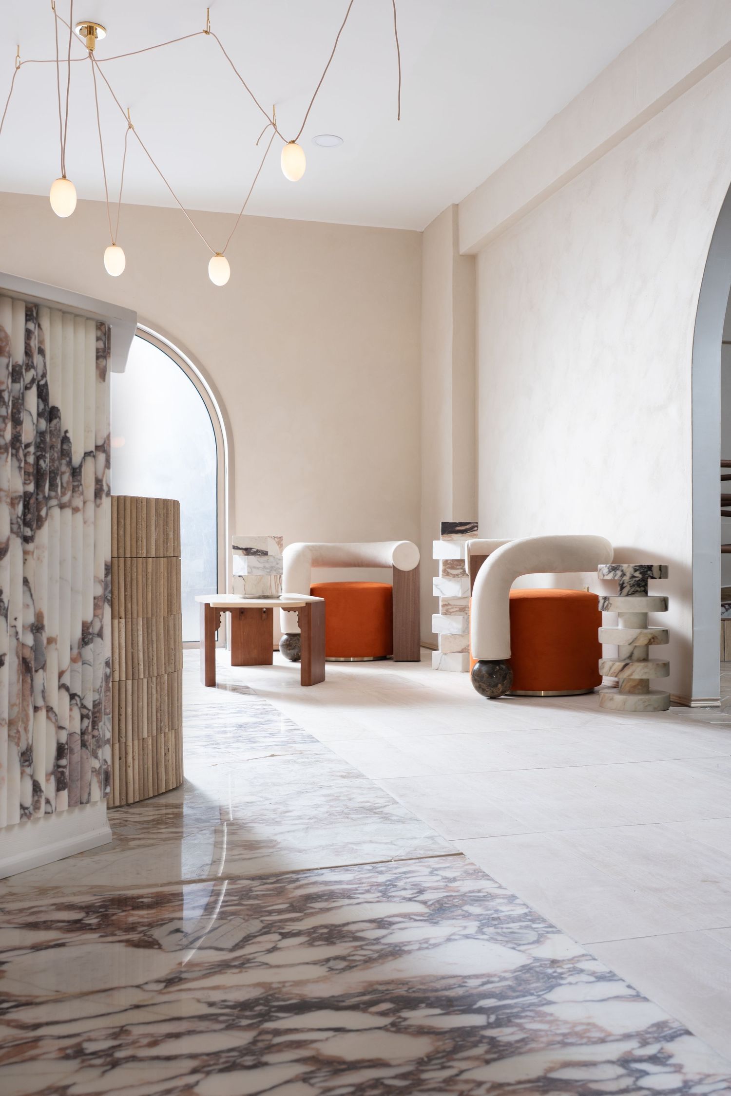 Elegant marble and natural wood interior of a luxury Michigan boutique or studio by Bylitos Studio Michigan