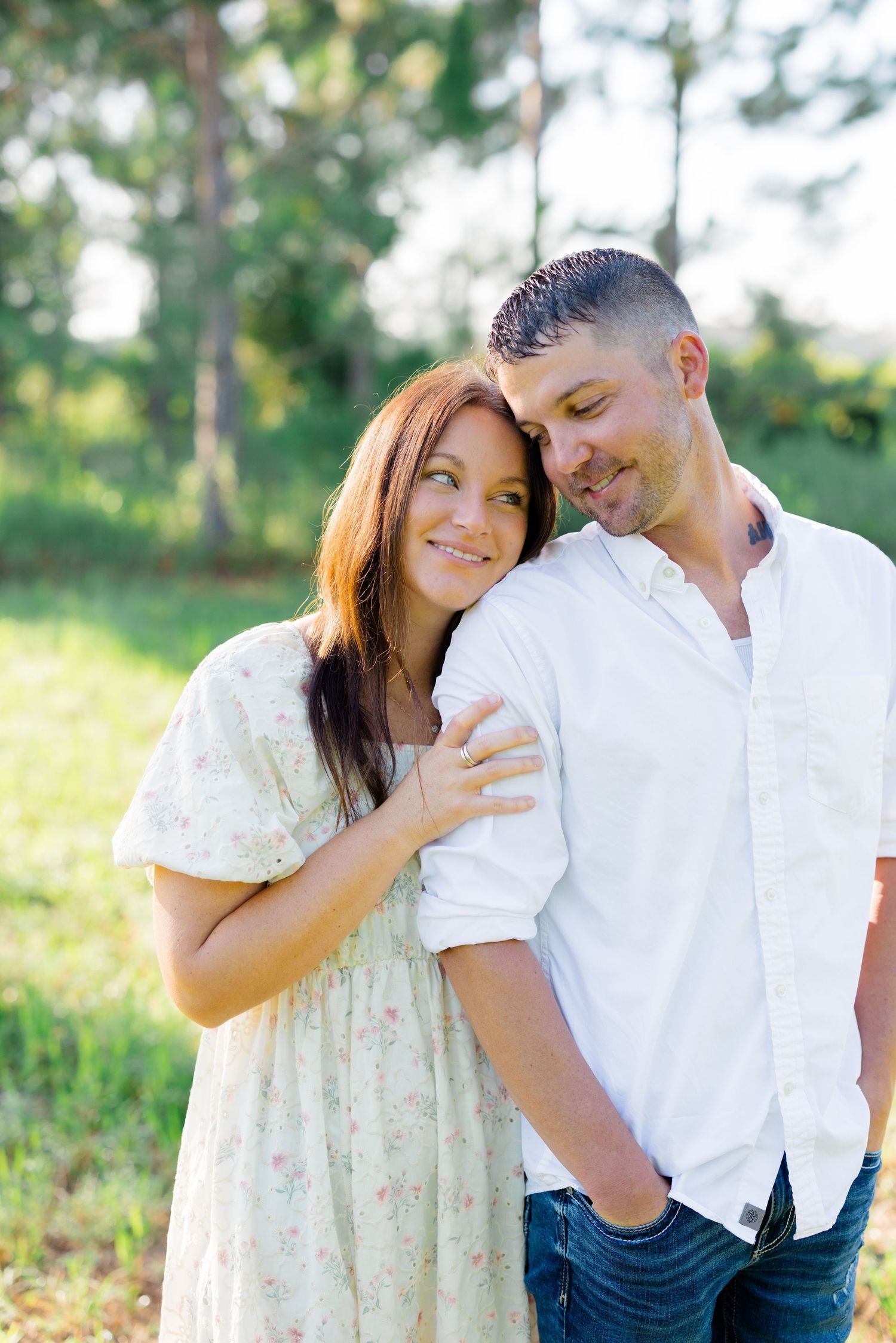 Romantic couple portraits showing tender moments in natural outdoor lighting.