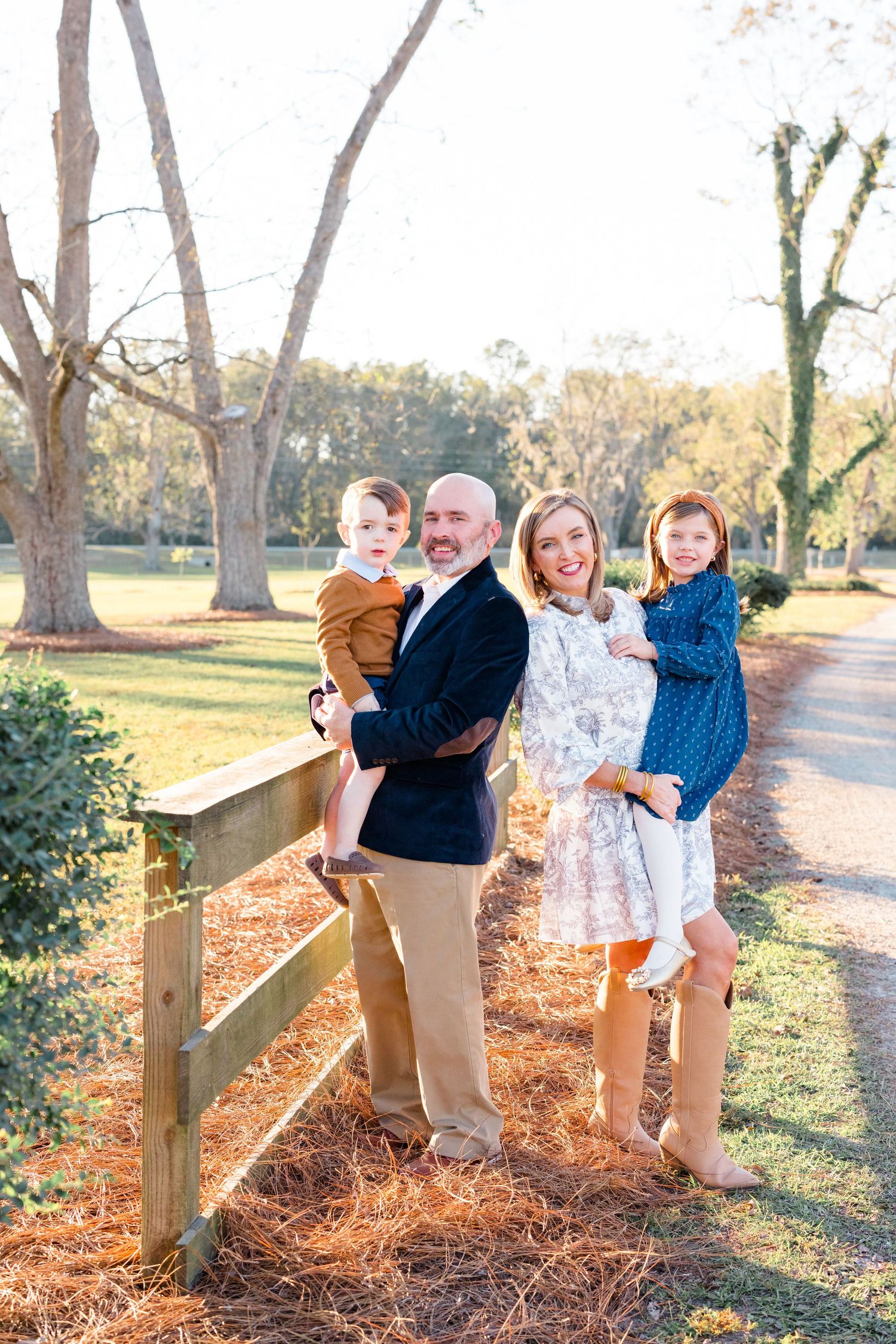 Family photo series at sunset showing playful interactions along a wooden fence in an autumn setting.