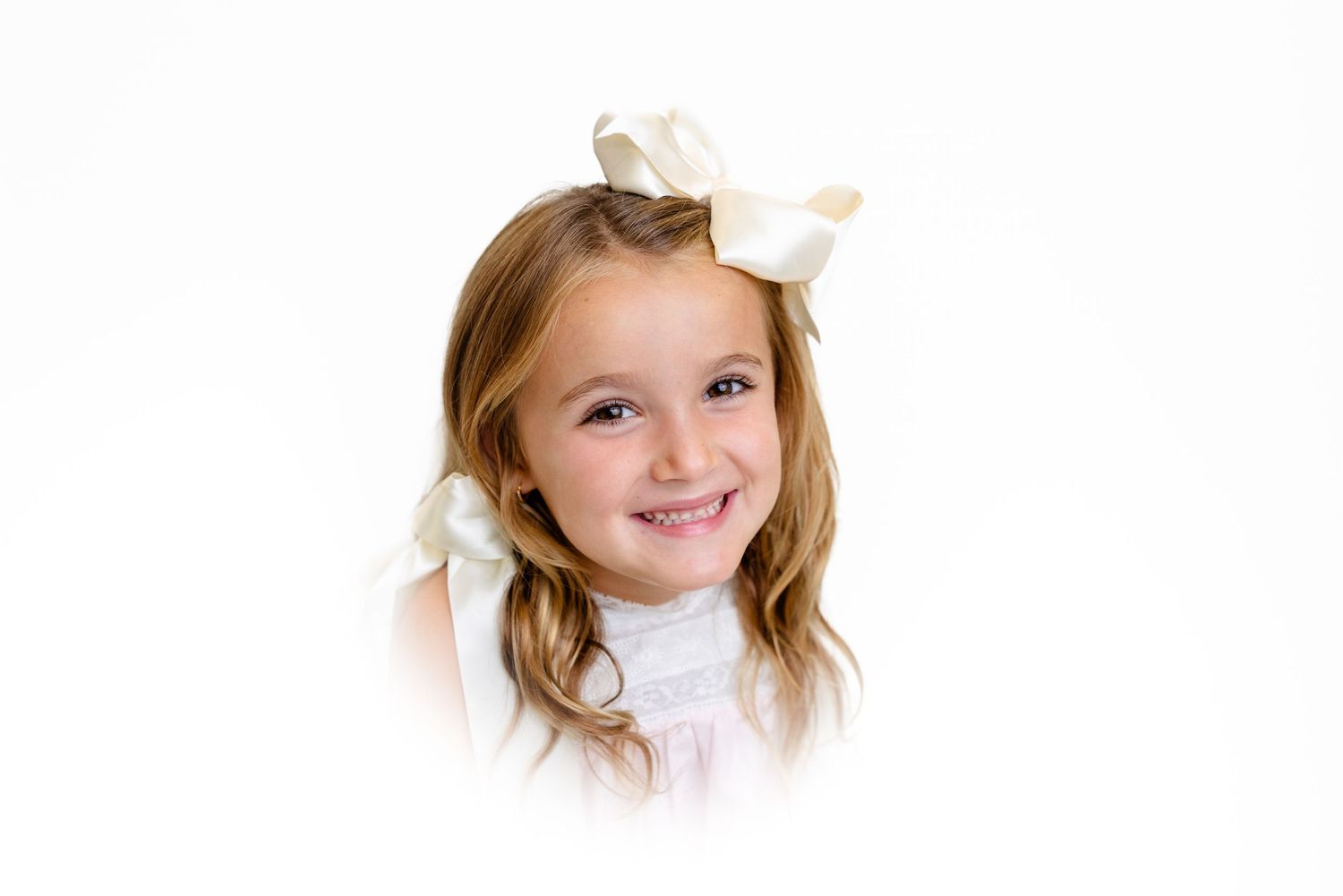 Studio portraits on white background showcasing bright smiles and natural expressions.