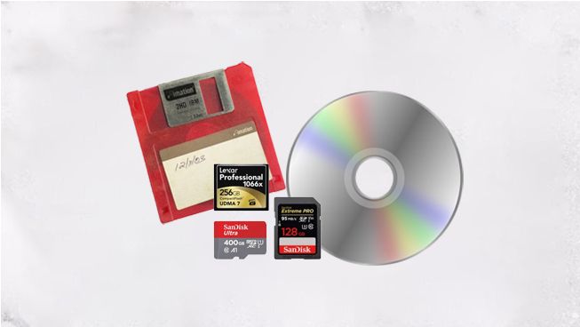 Digital storage devices including memory cards, optical discs, and flash drives arranged on white background.