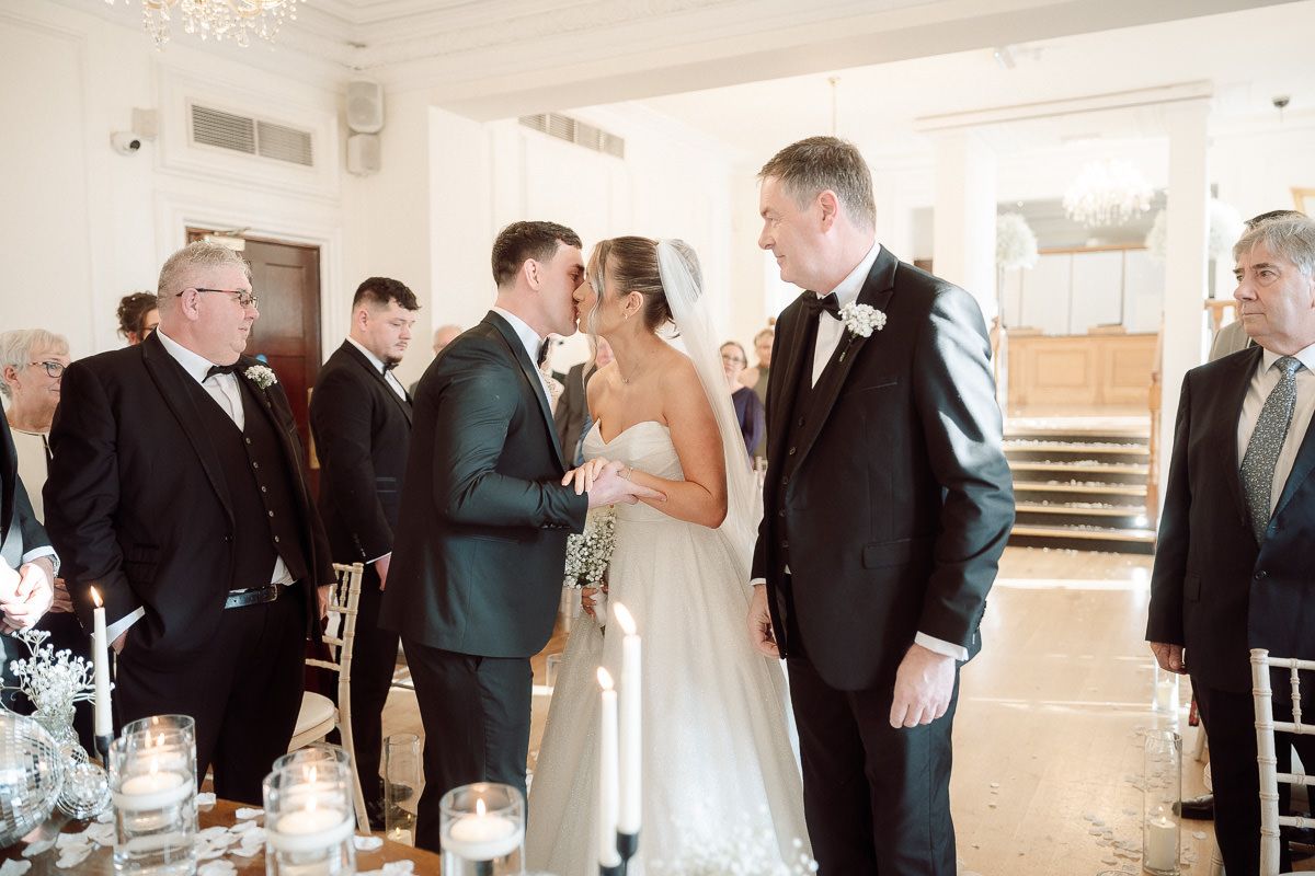 A sequence of wedding ceremony moments captured in a horizontal collage showing intimate exchanges between couples.