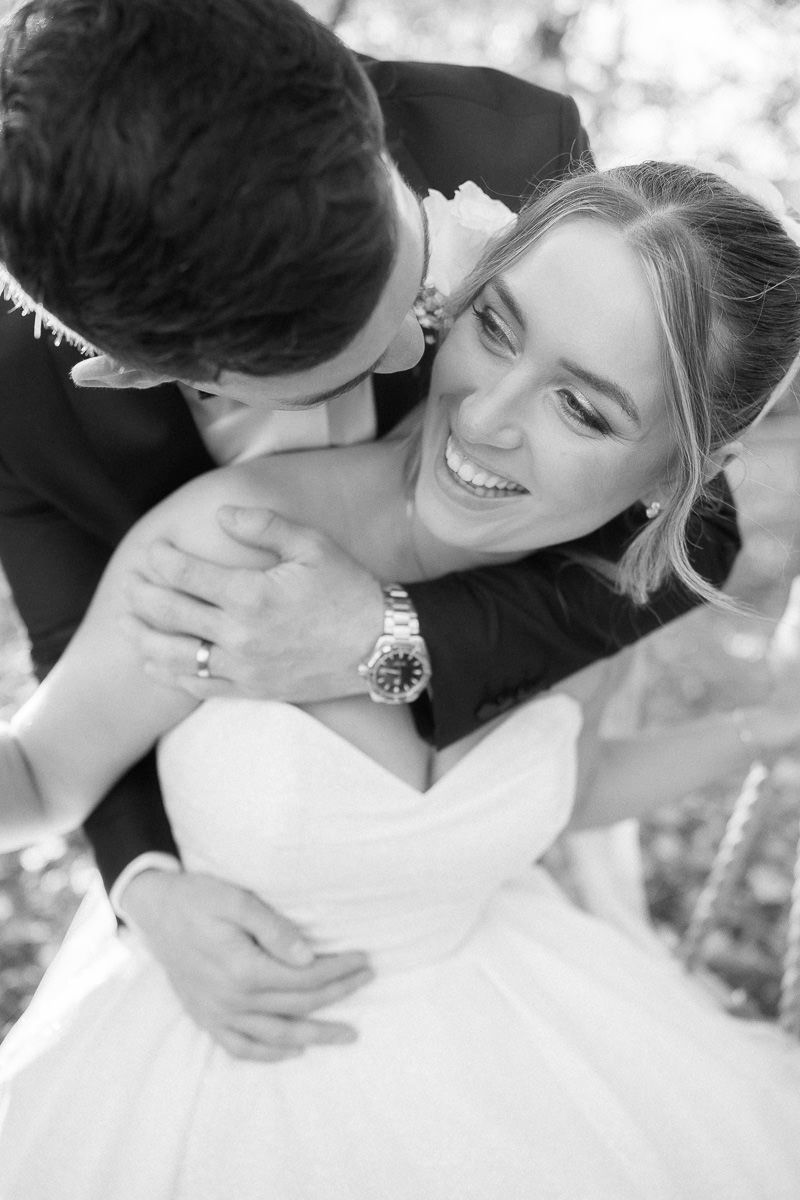 Close-up black and white wedding photos capture intimate romantic moments between newlyweds.
