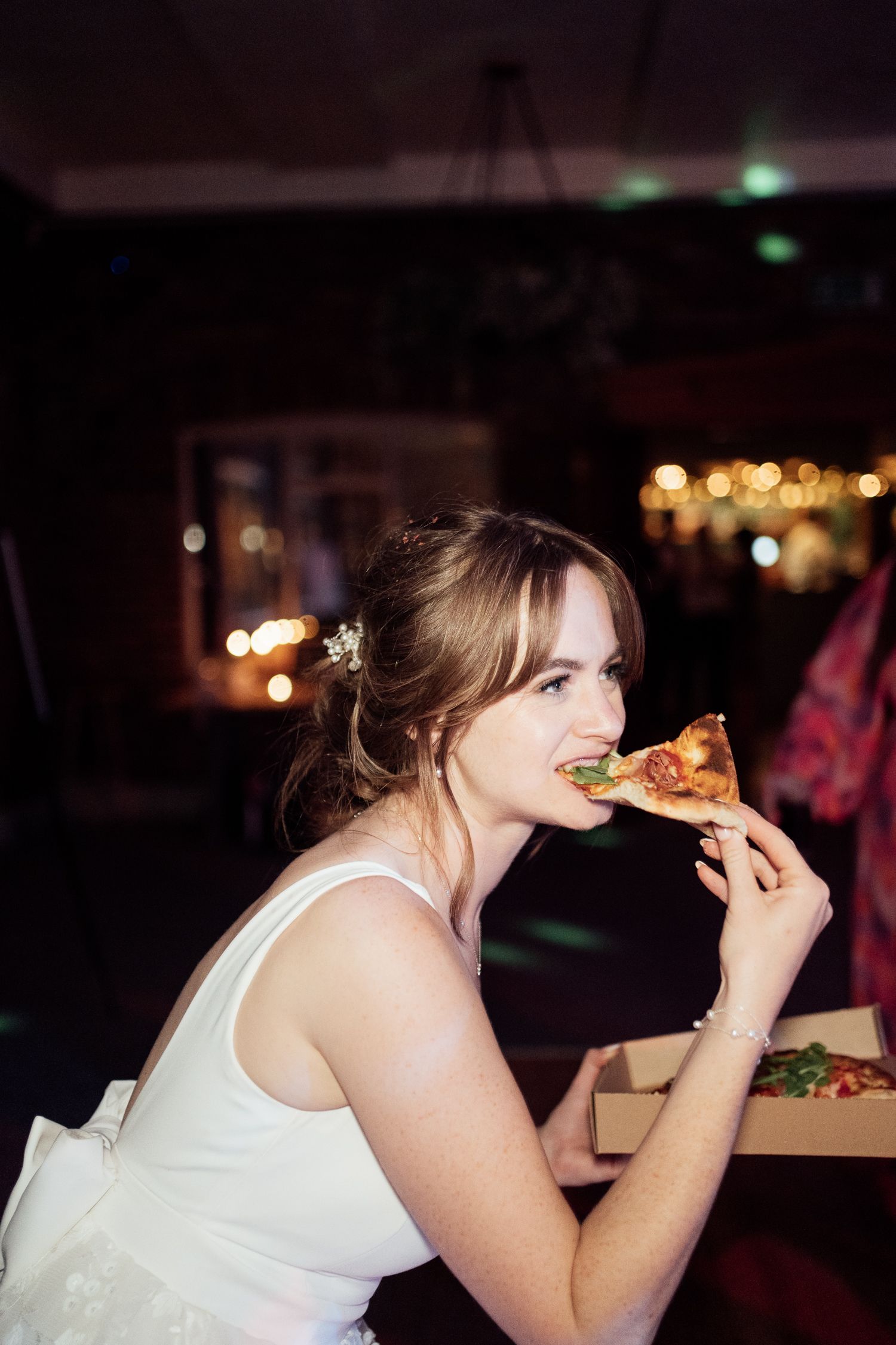 At a reception, someone in a white dress takes bites of food in a sequence of candid photos across multiple frames.
