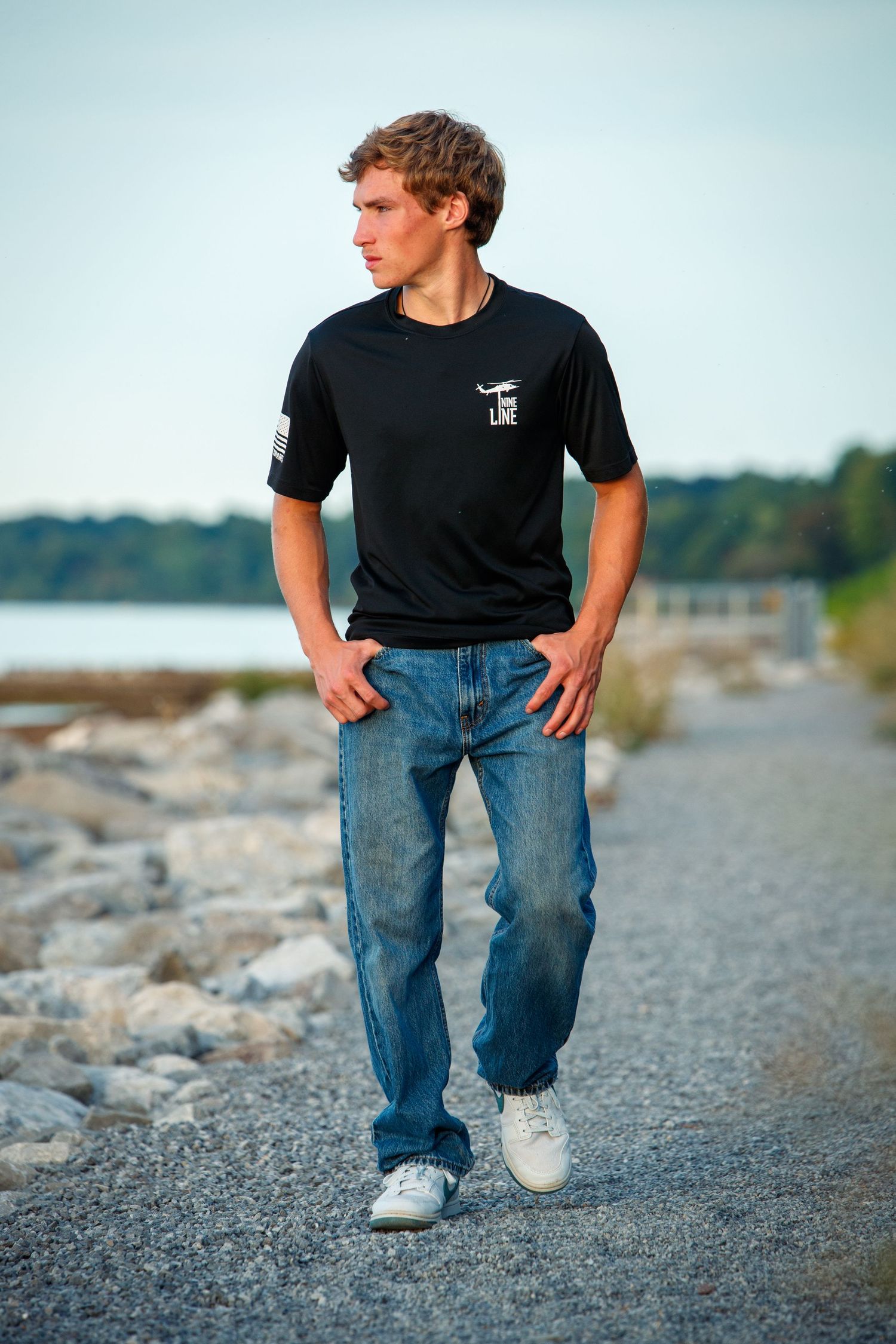 Relaxed senior portrait beside Lake Ontario
