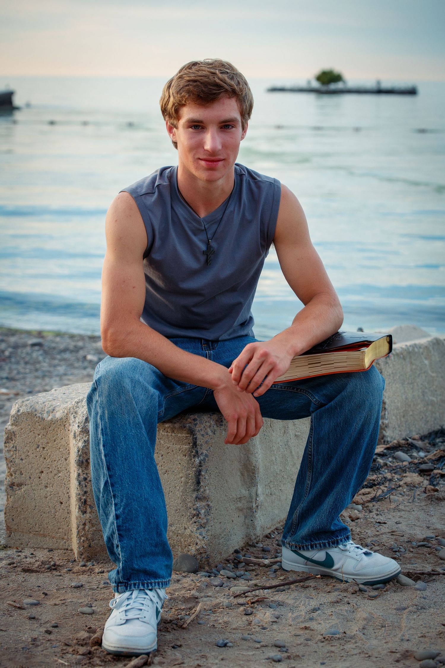 Casual outdoor senior portrait near the waterfront