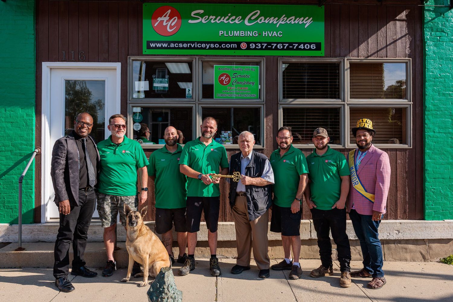 AC Service Company team and community members celebrating the passing of the key Yellow Springs Ohio