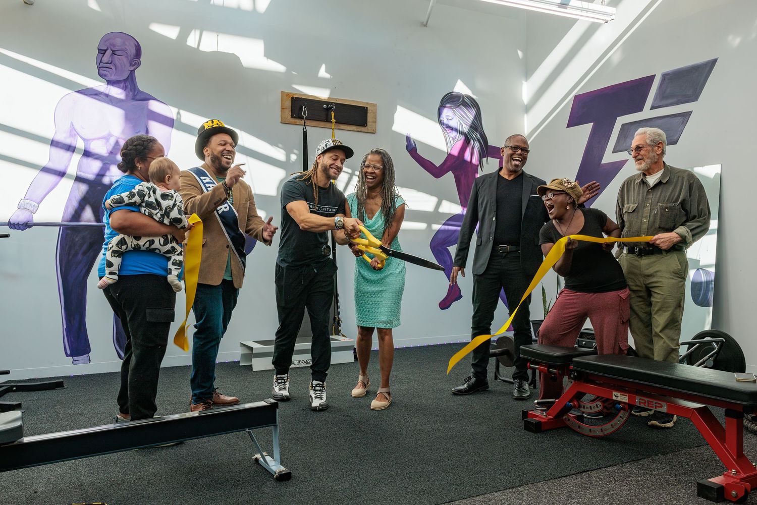 Kyle Truitt cutting the ceremonial ribbon at the Truitt Fitness grand re-opening in Yellow Springs.