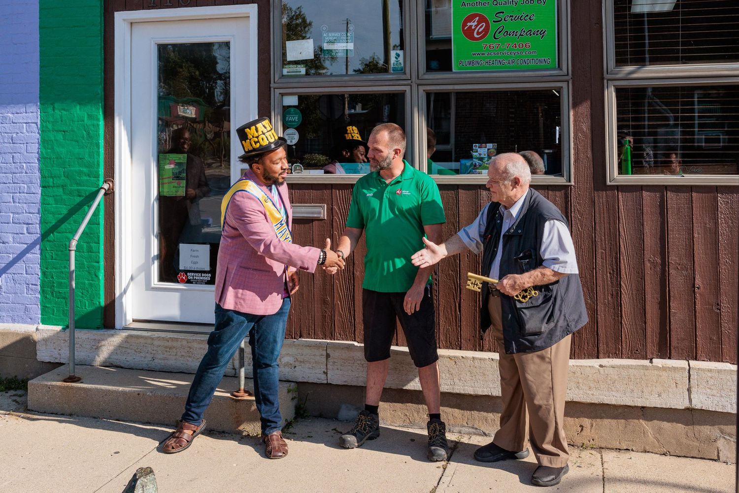 Handshake and congratulations outside AC Service Company Yellow Springs Ohio