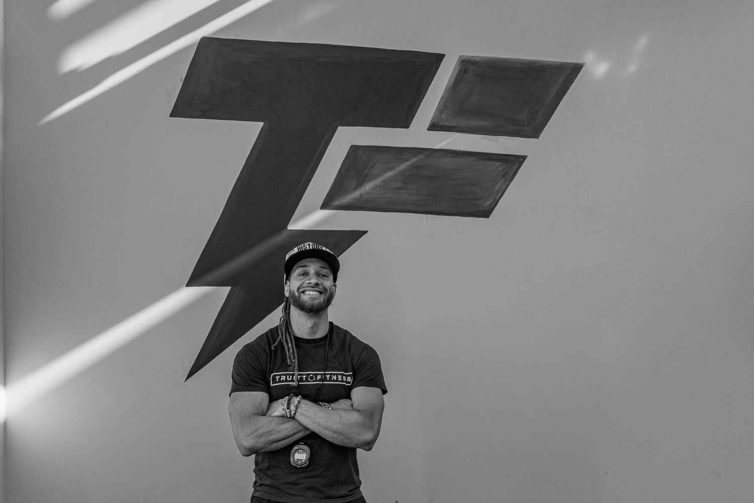 Black and white portrait of Kyle Truitt beneath the Truitt Fitness logo.