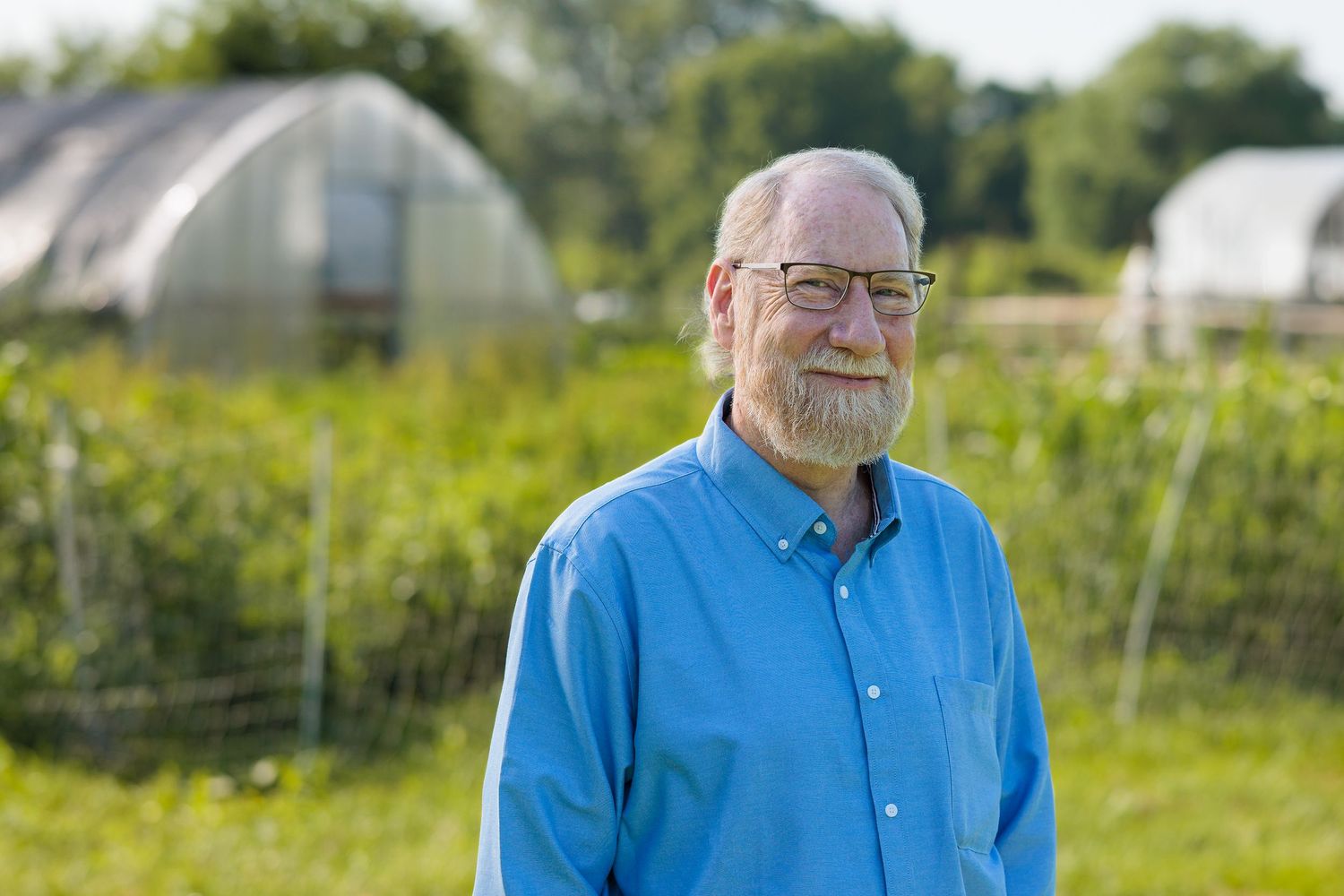 Portrait of Roi Qualls outdoors near the Antioch Farm greenhouses, Yellow Springs Ohio