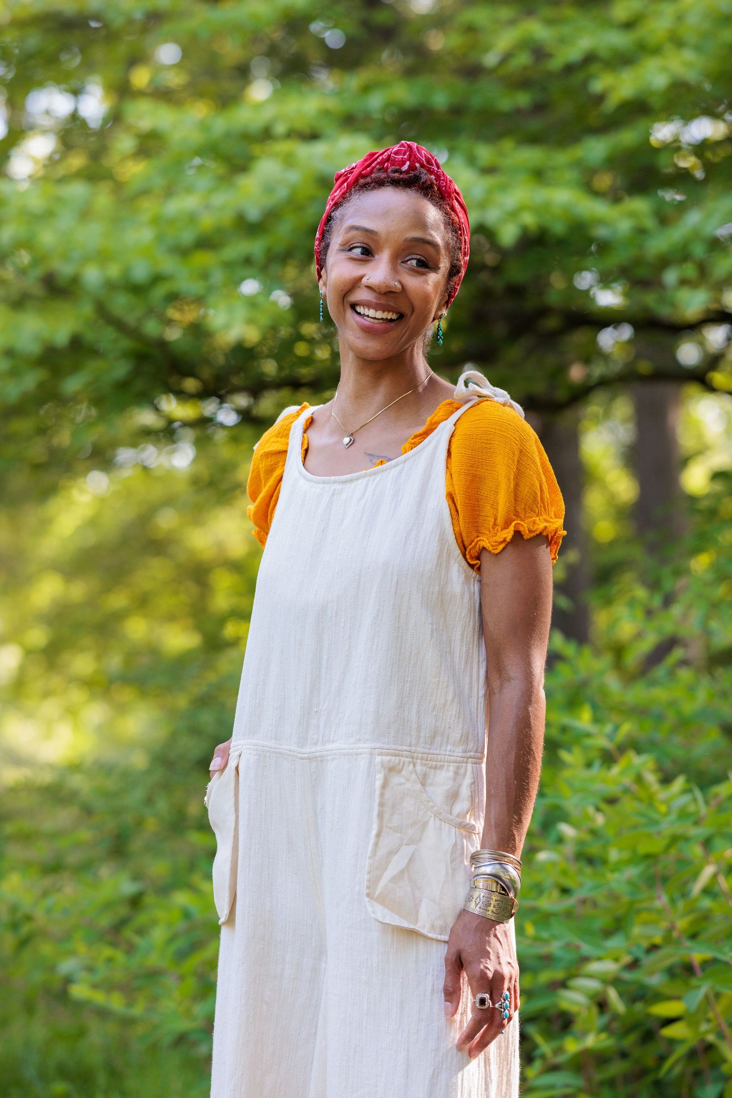 Portrait of Hyacinth standing outdoors in greenery, co-author of Points of Failure Vol. 1: Interwoven