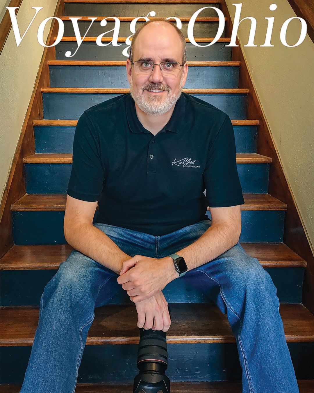 Voyage Ohio magazine cover featuring Karl Yost seated on wooden stairs with his camera