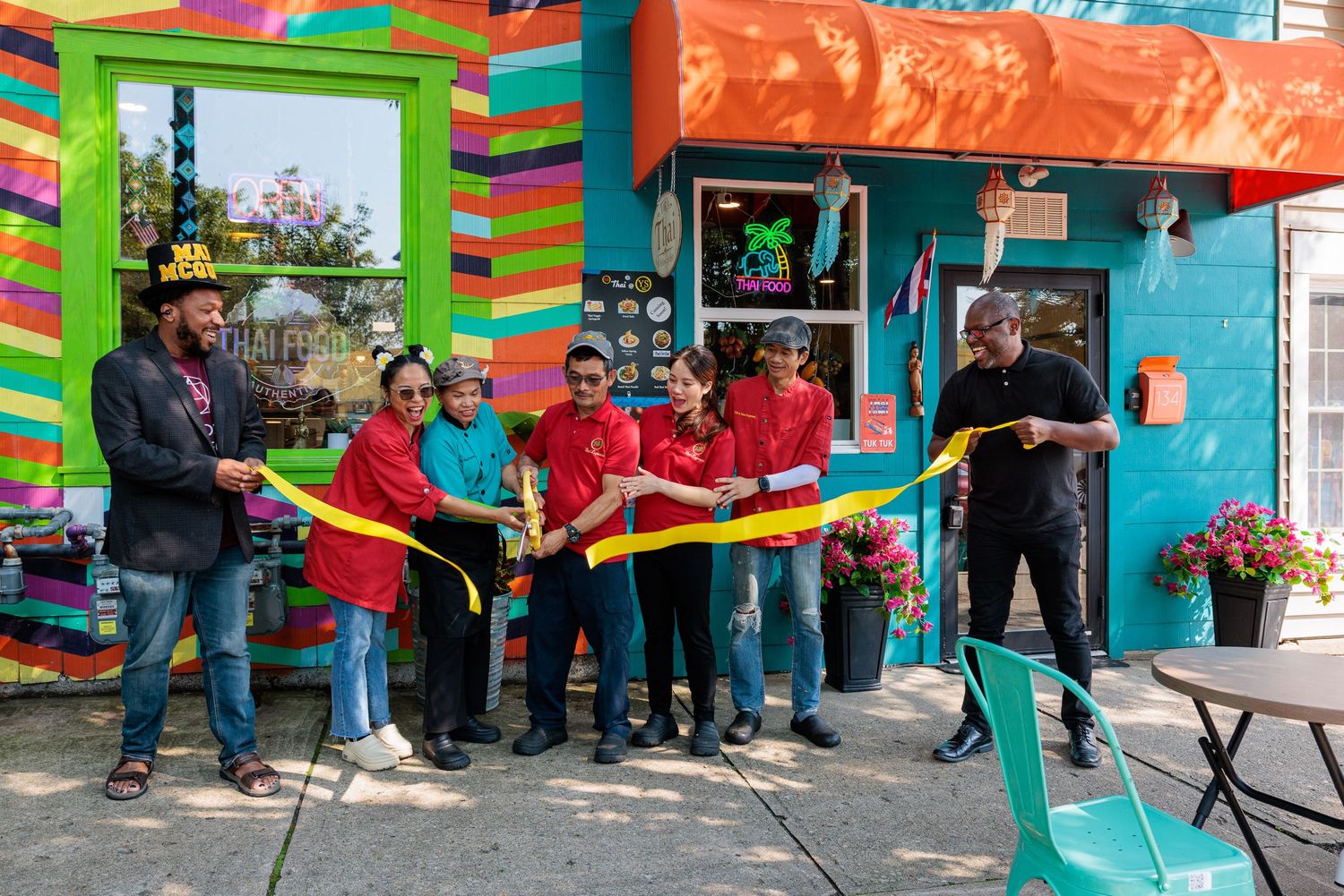Mayor and Tik's Thai team ribbon cutting at grand opening on Dayton Street Yellow Springs Ohio