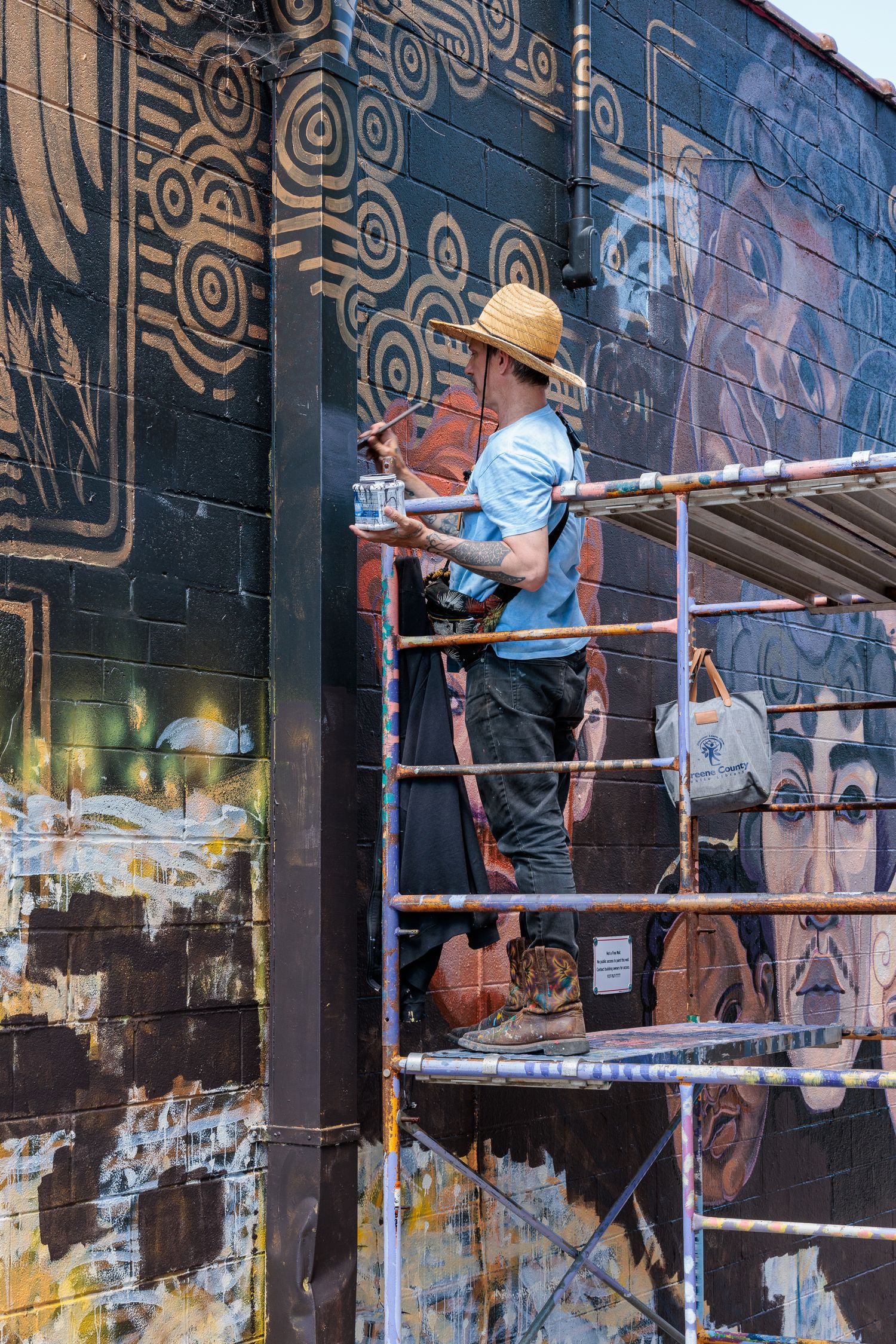Muralist Pierre Nagley on scaffolding painting geometric mural patterns