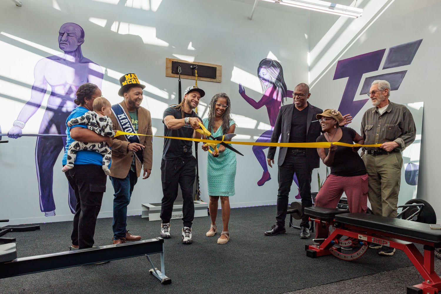 Kyle Truitt cutting the ribbon as Chamber representatives and guests celebrate.