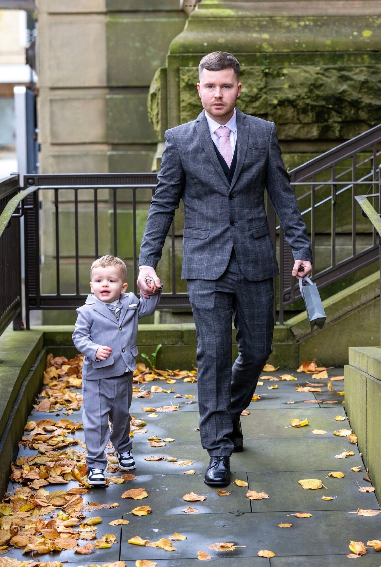 Groom walking with son