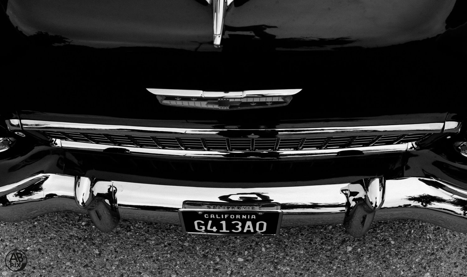 Black and white photo of a classic car rear with California license plate reading G413AO.