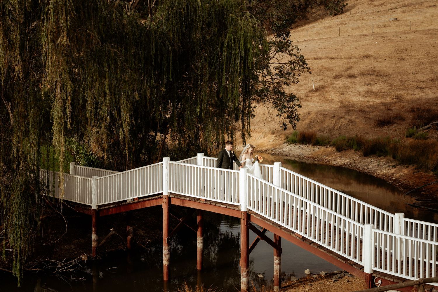Couple walking along bridge at Quarry Farm