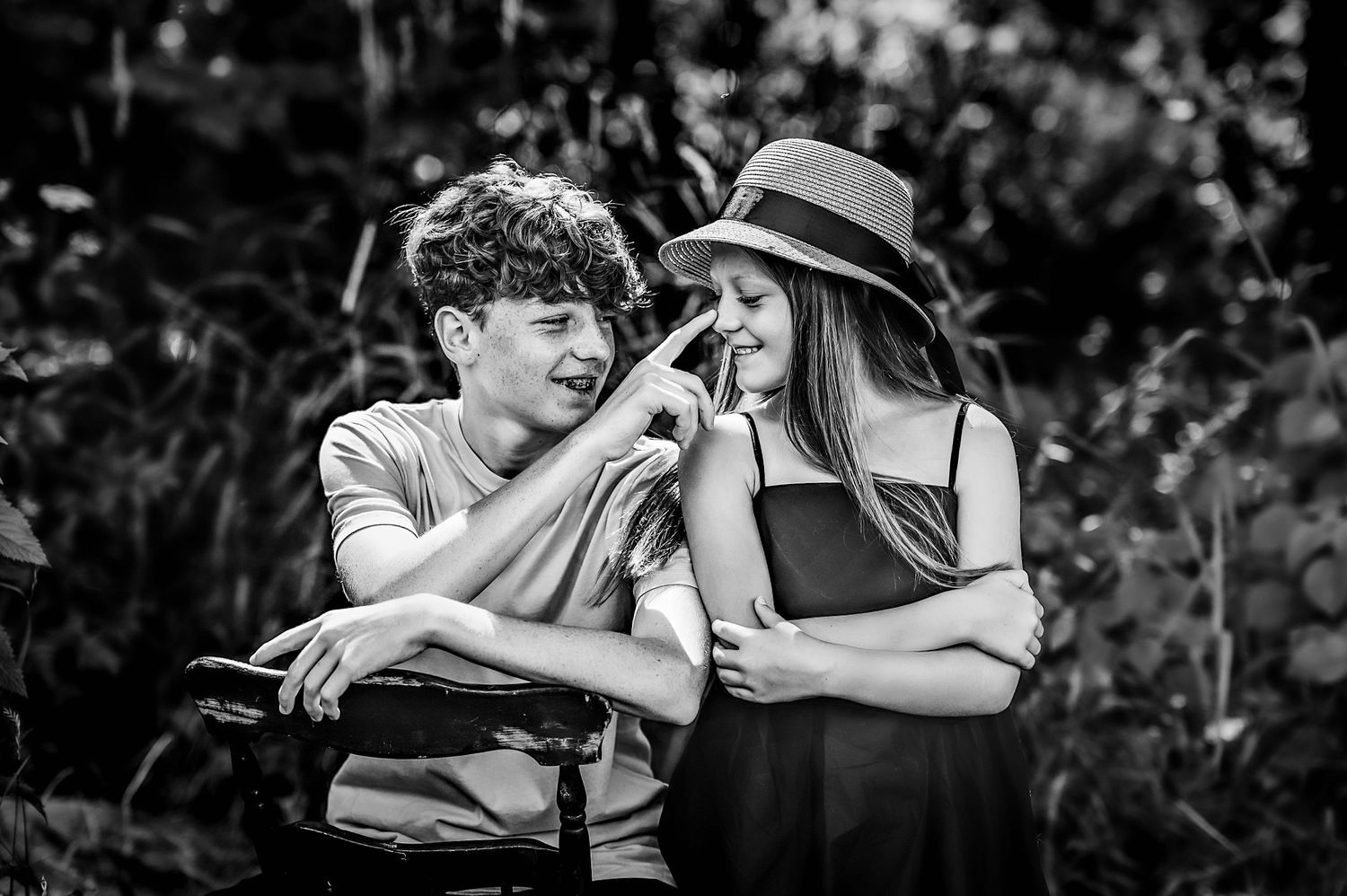 Black and white outdoor portrait series capturing intimate family moments.
