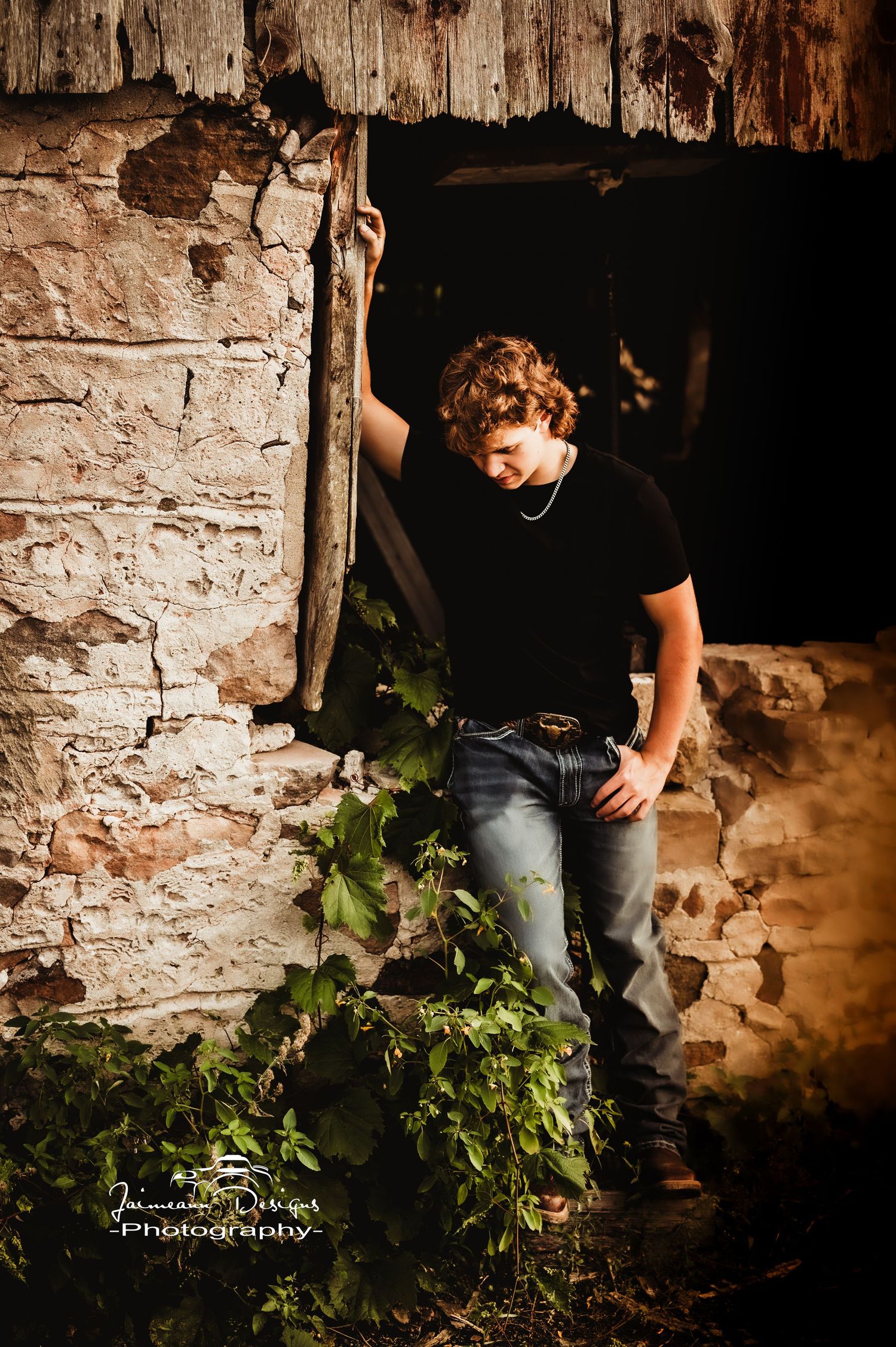 Rustic stone wall setting with climbing vines creates moody atmosphere.