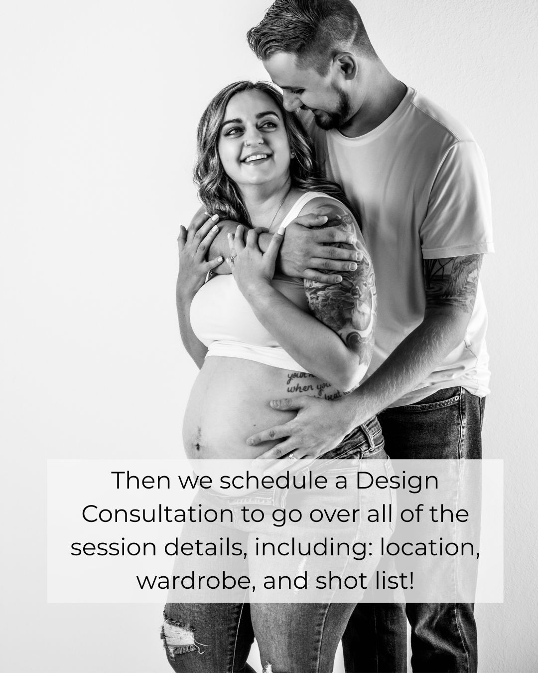 Pregnant couple embracing during maternity photo session, man kissing woman's head while holding baby bump.
