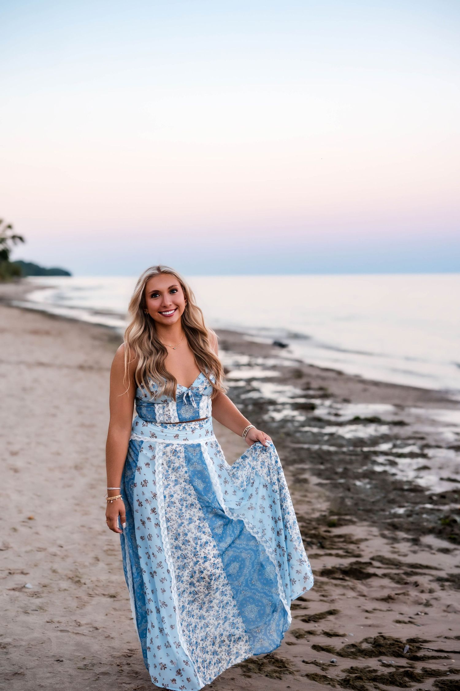 Senior girl laughing on the beach during her Port Washington senior session