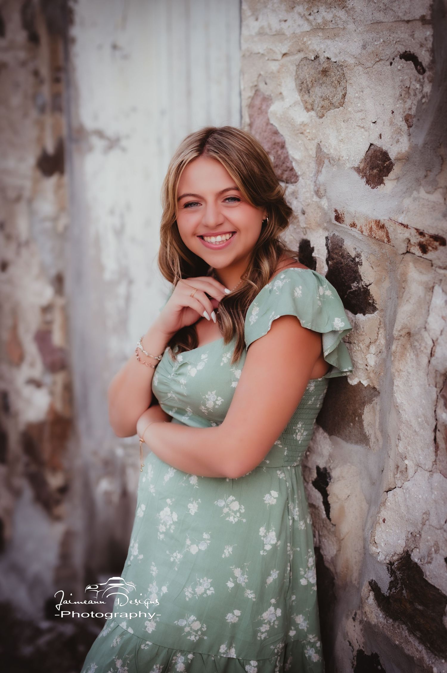 A joyful portrait against textured stone and wood walls in vintage style.