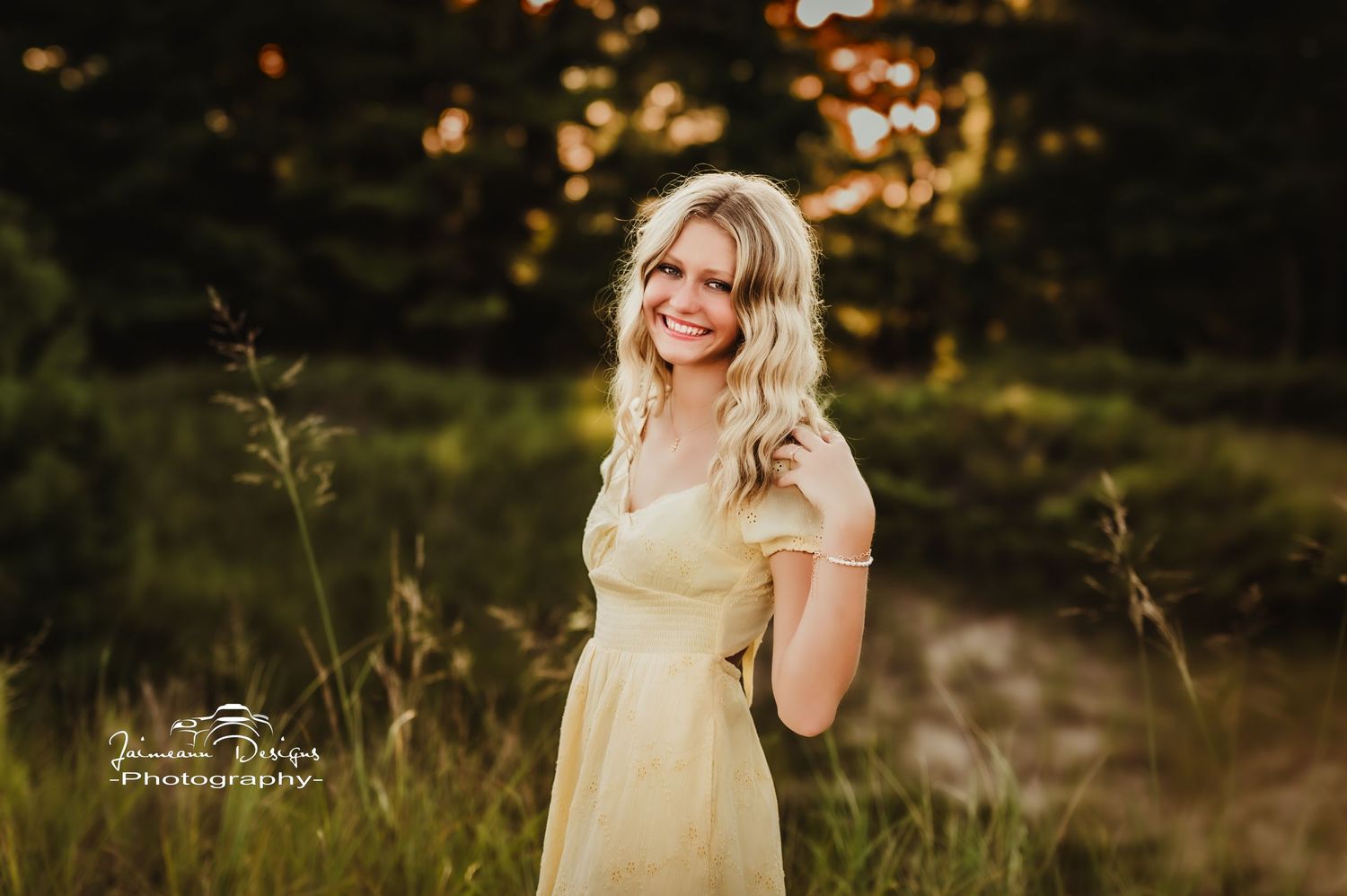 Golden hour portrait in natural meadow setting with warm lighting.