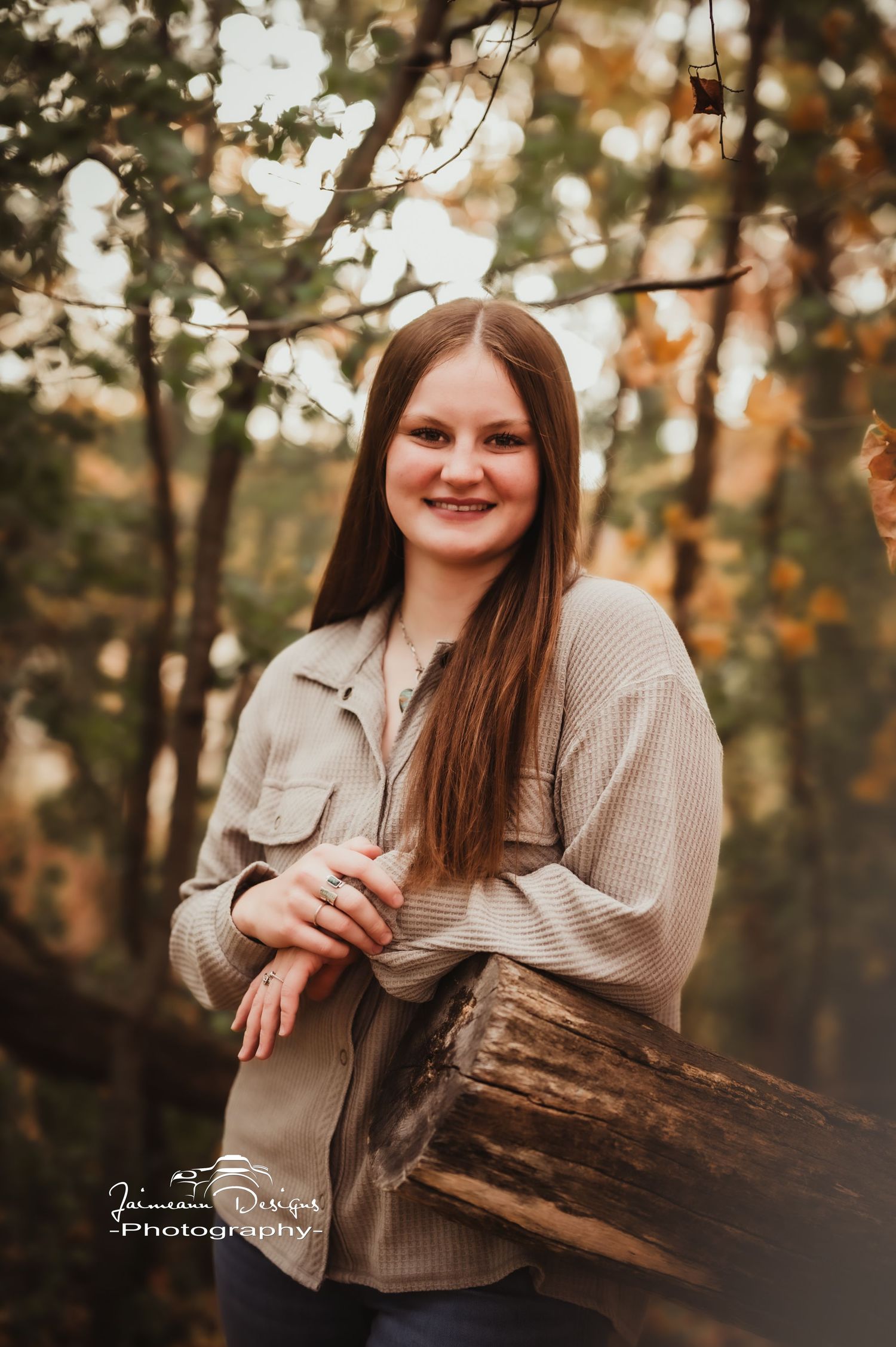 Autumn portrait in nature featuring casual beige sweater and natural woodland setting.