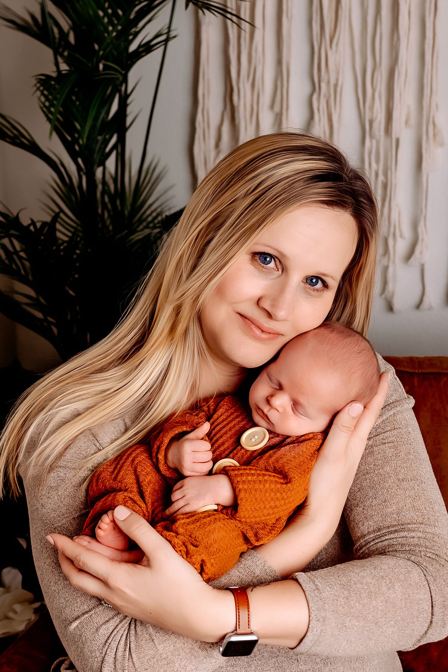 Mom and Newborn posing in Cozy Studio for newborn photo near Campbellsport, WI
