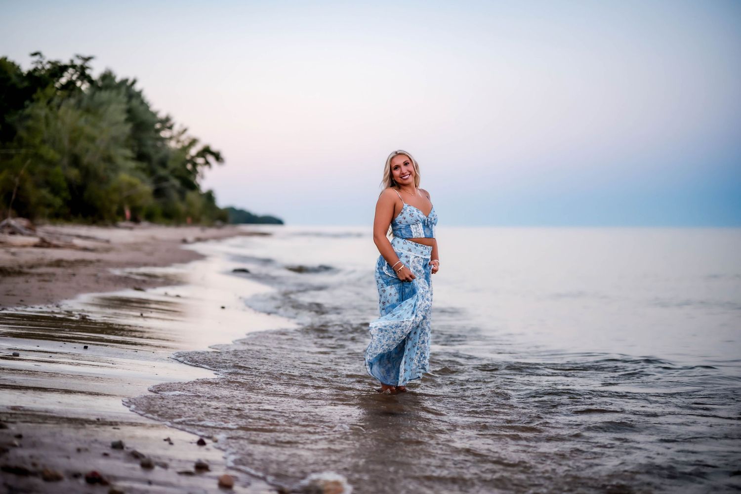 Senior girl in a dressy blue maxi dress for Lake Michigan senior photos