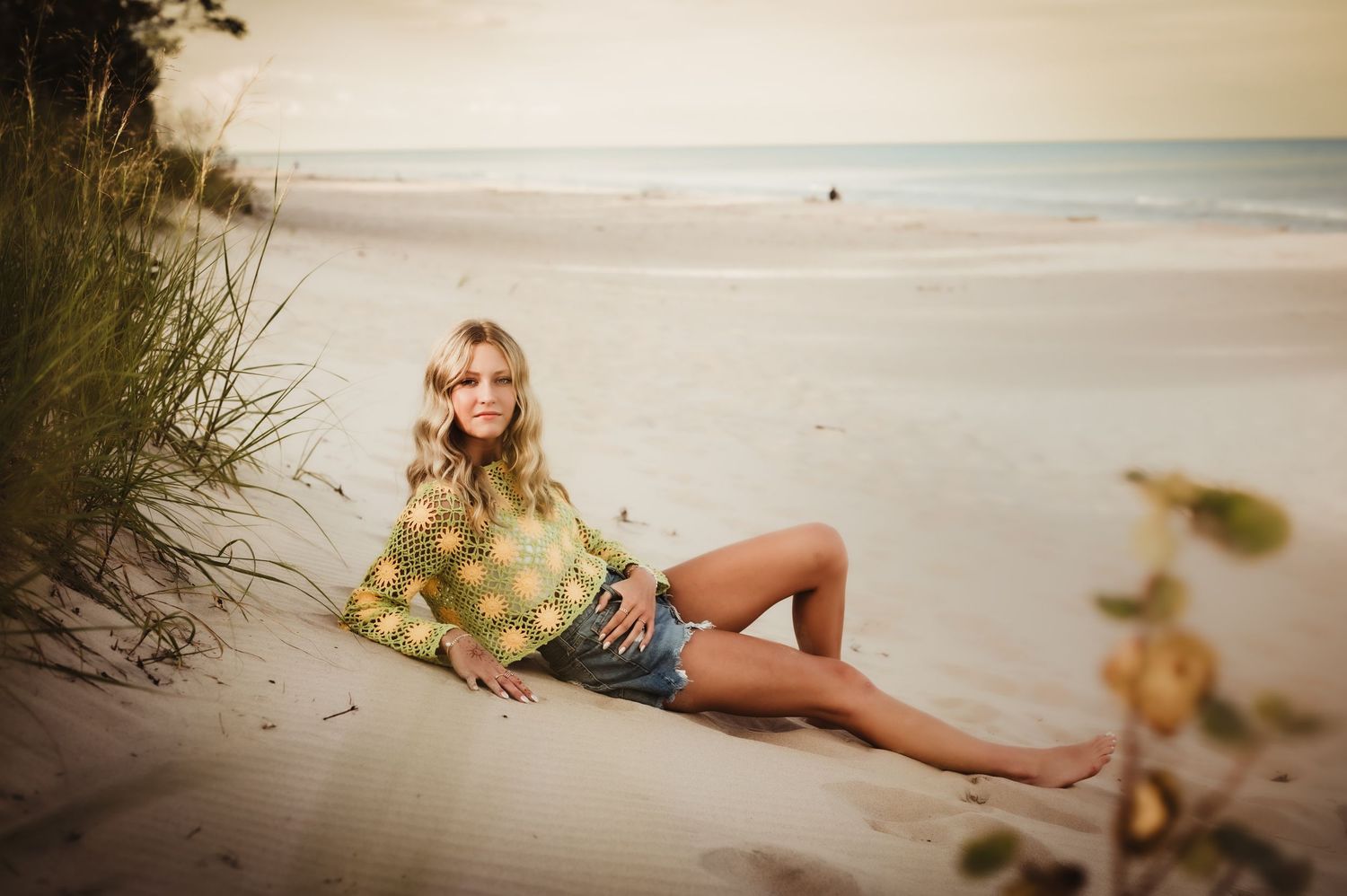 A series of beachside photos at sunset with someone posing on the sand in a yellow dress, Sheboygan, WI